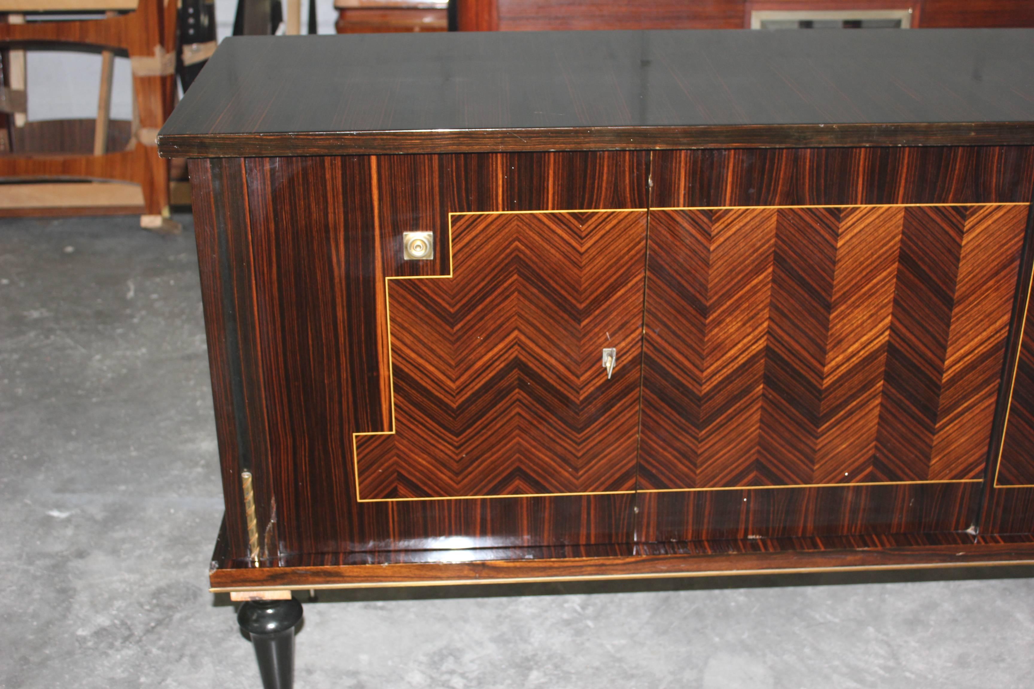 A French Art Deco Sideboard / Buffet Macassar ebony zigzag design , circa 1940s. high gloss finish and Finished interior.
