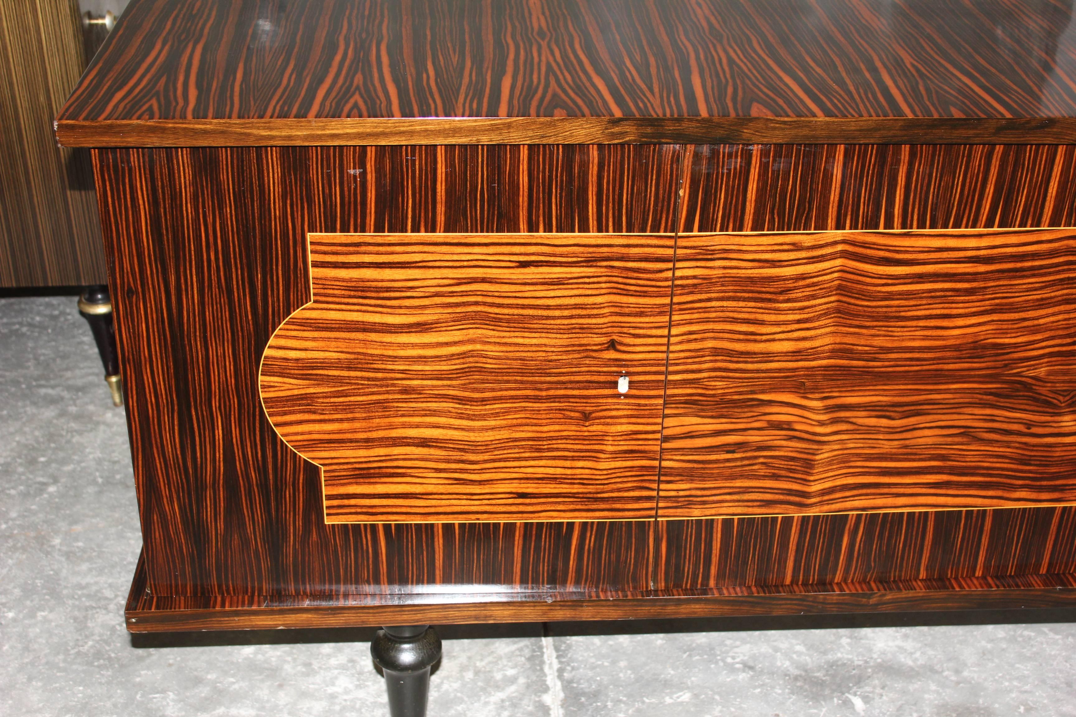 A French Art Deco sideboard /buffet  Macassar ebony, circa 1940s. High gloss finish and interior Finished ,circa 1940.