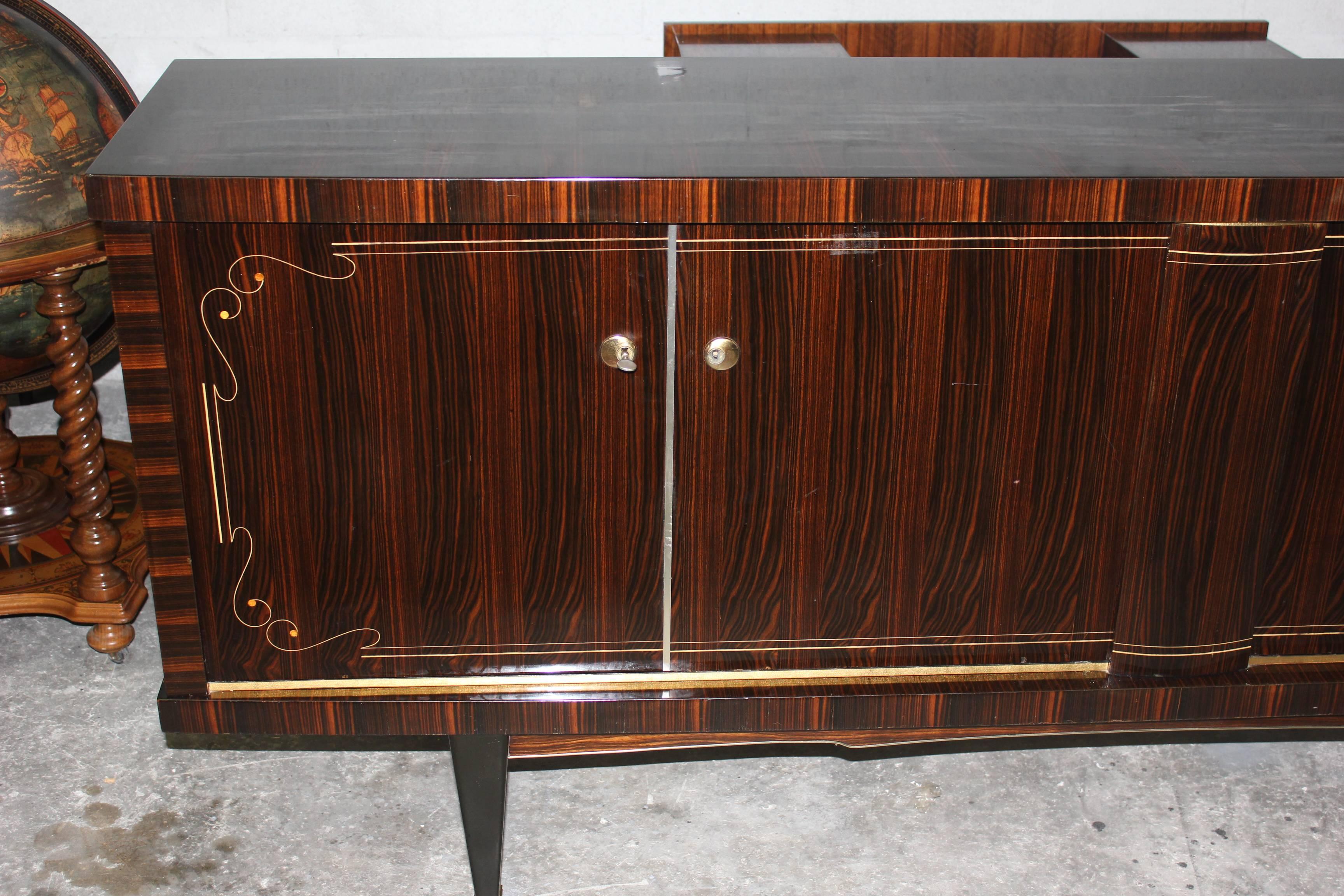 A French Art Deco exotic Macassar ebony buffet or credenza, circa 1940s. Interior finished in lemonwood.