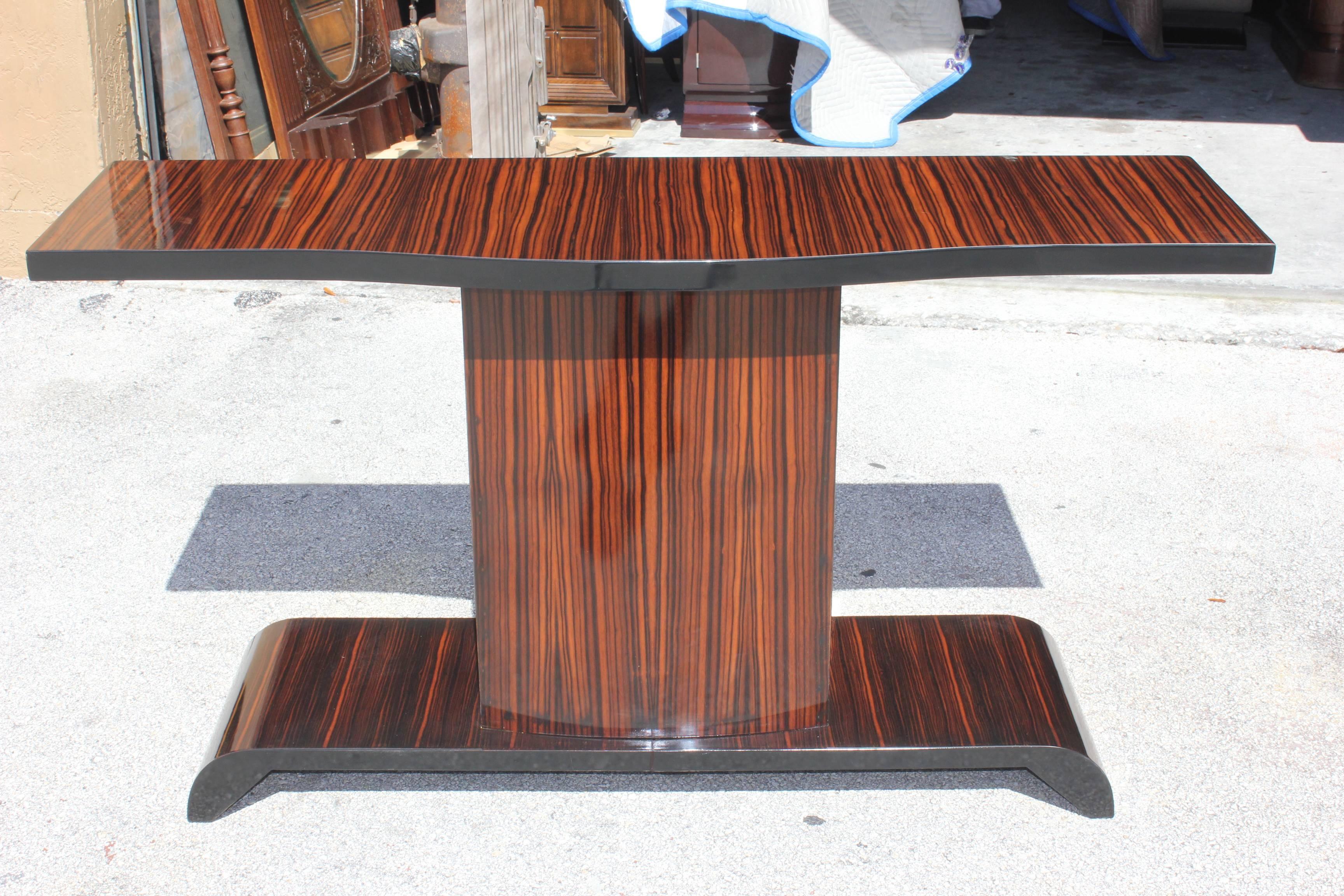 A gorgeous French Art Deco Exotic Macassar Ebony Console Table with grand proportions. This piece will be the focal point in the room.