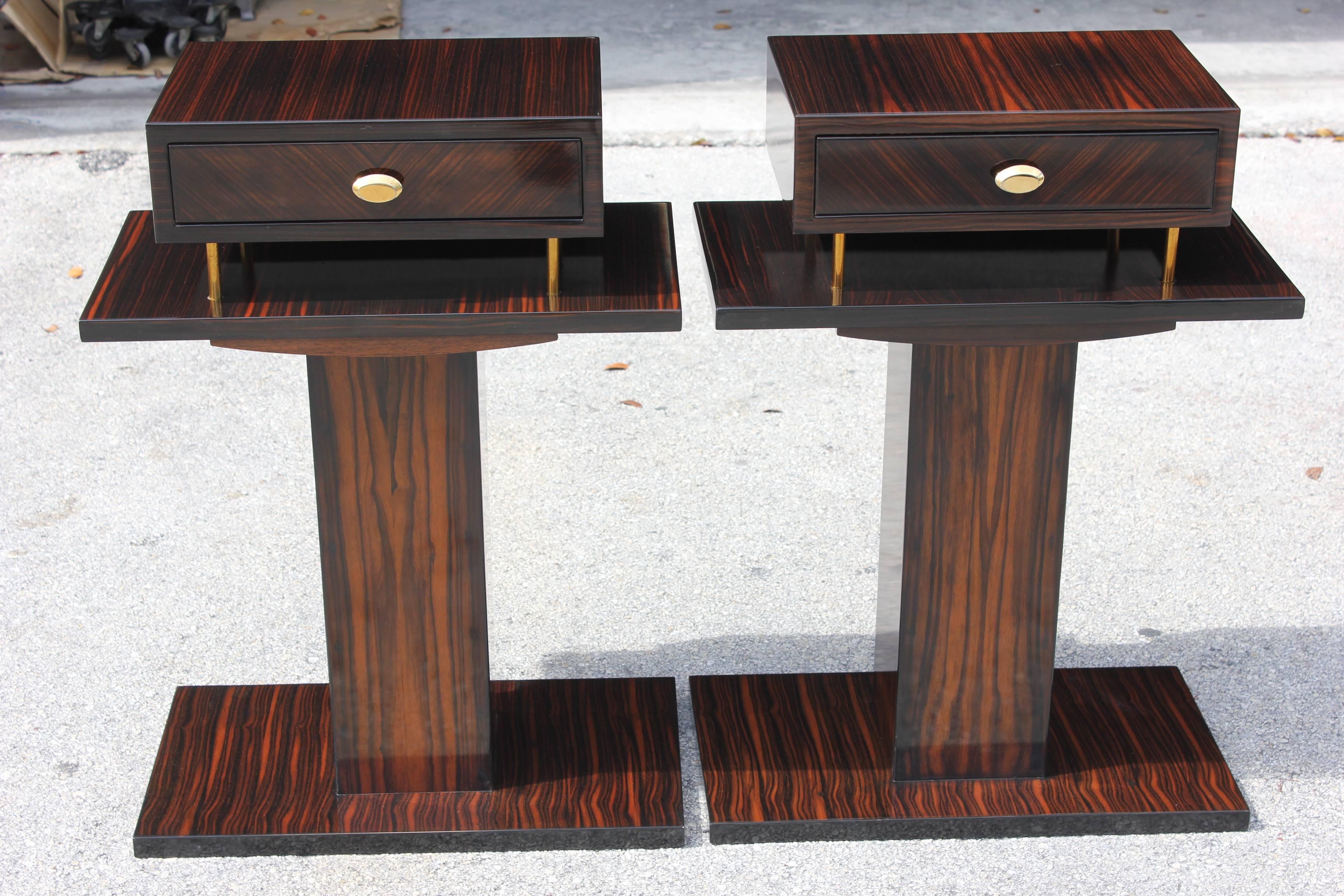 A beautiful and large sized pair of French Art Deco Exotic Macassar Ebony Night Tables or End Tables, circa 1940s. Refinished in french lacquer.
