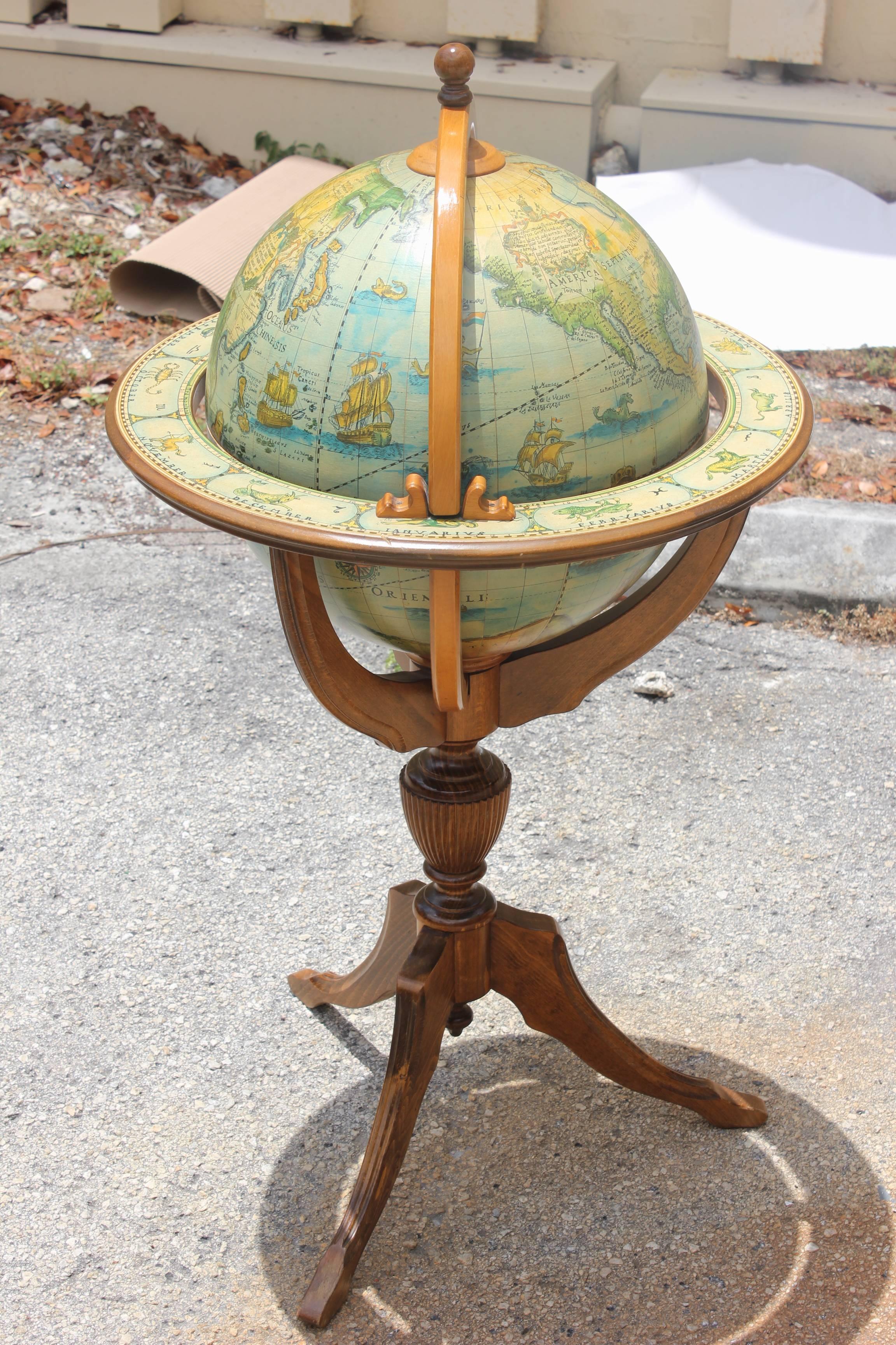 A French Mid-Century Modern world globe bar, circa 1960s. Top opens to reveal bar.