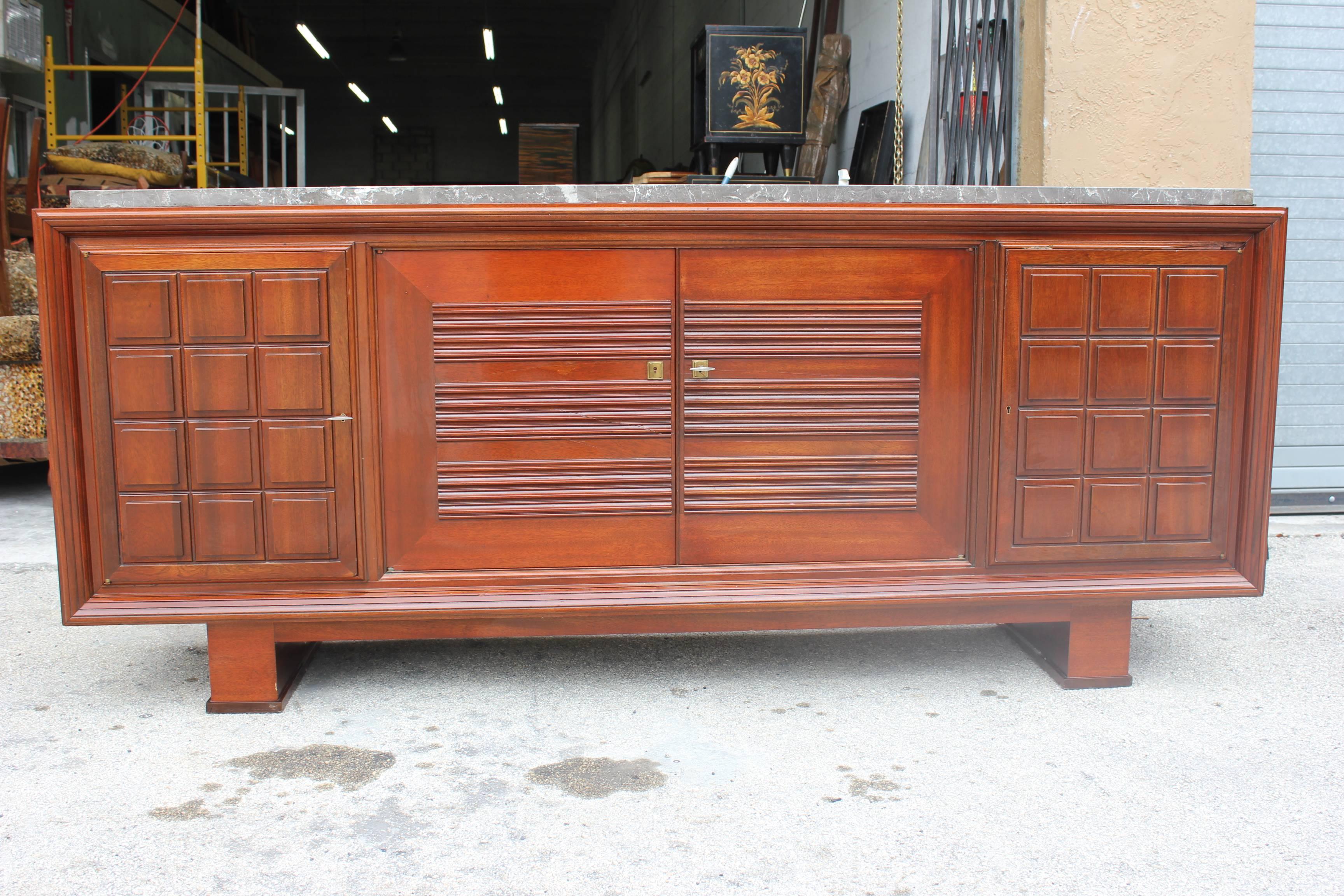 Quite the masterpiece here! A French Art Deco solid mahogany buffet by Designer Maxime Old, circa 1940s. Documented in the book 