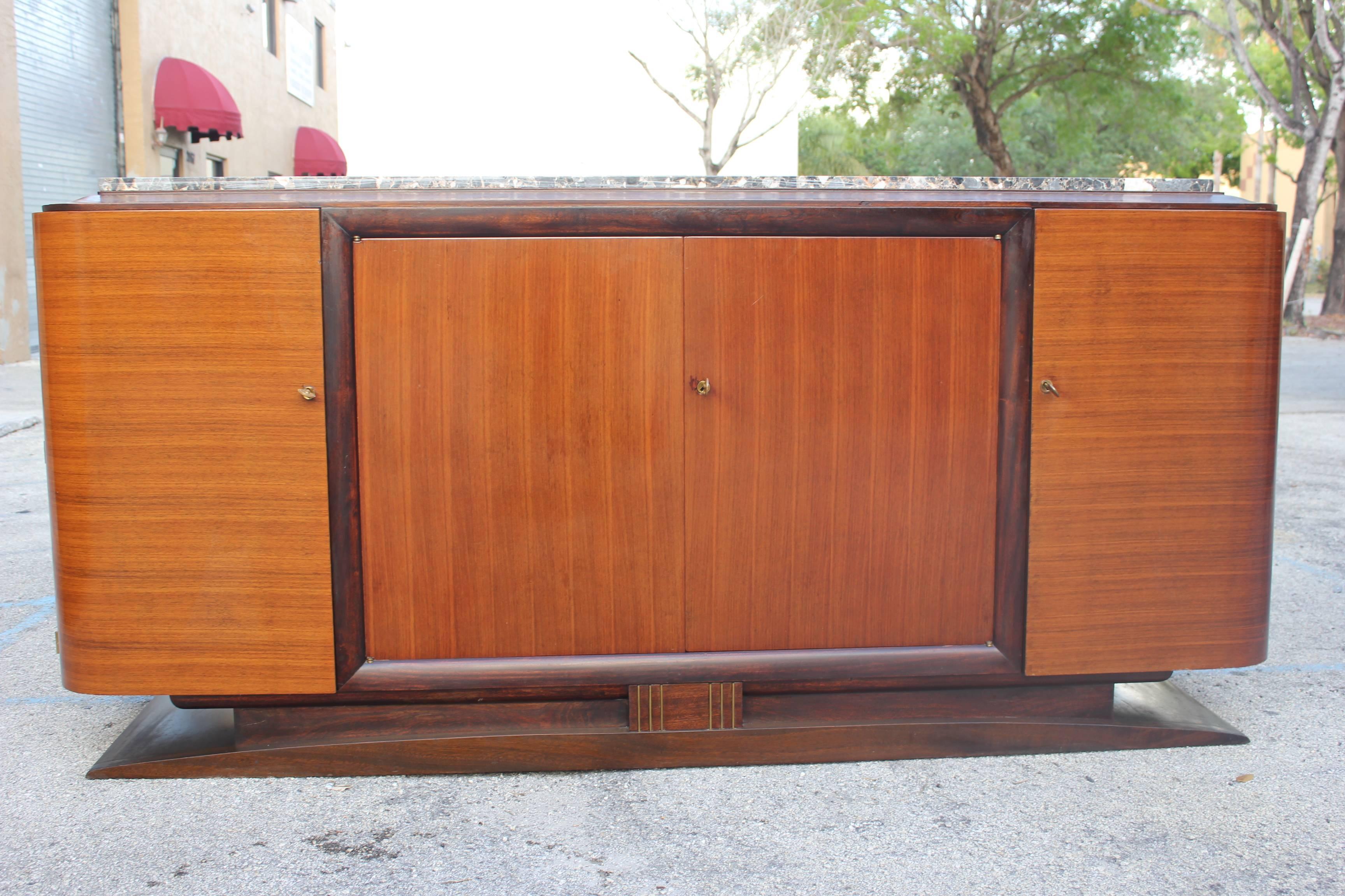 A beautiful French Art Deco exotic macassar ebony sideboard buffet with marble top. Finished interior, steeped top.(with the original finish very good condition. )circa 1940s.