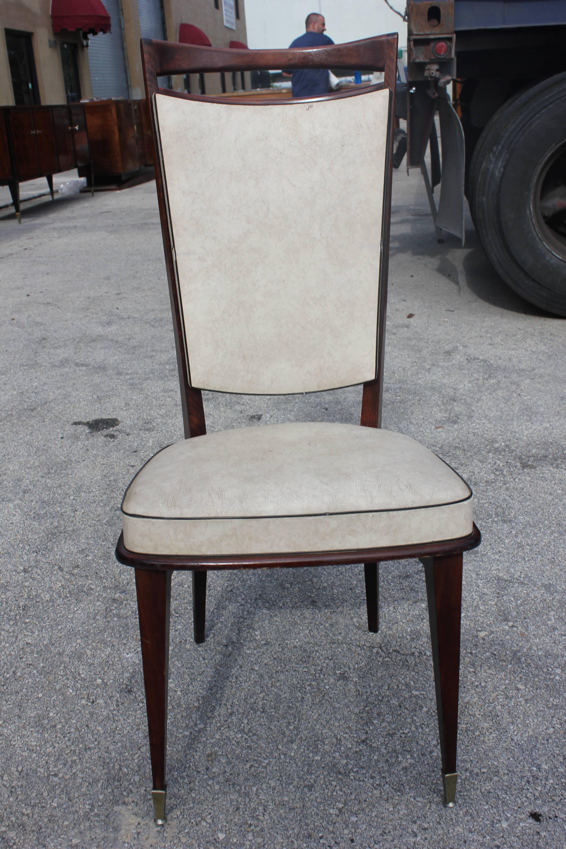 A set of five French Art Deco walnut dining chairs, circa 1940s. Reupholstery recommended.