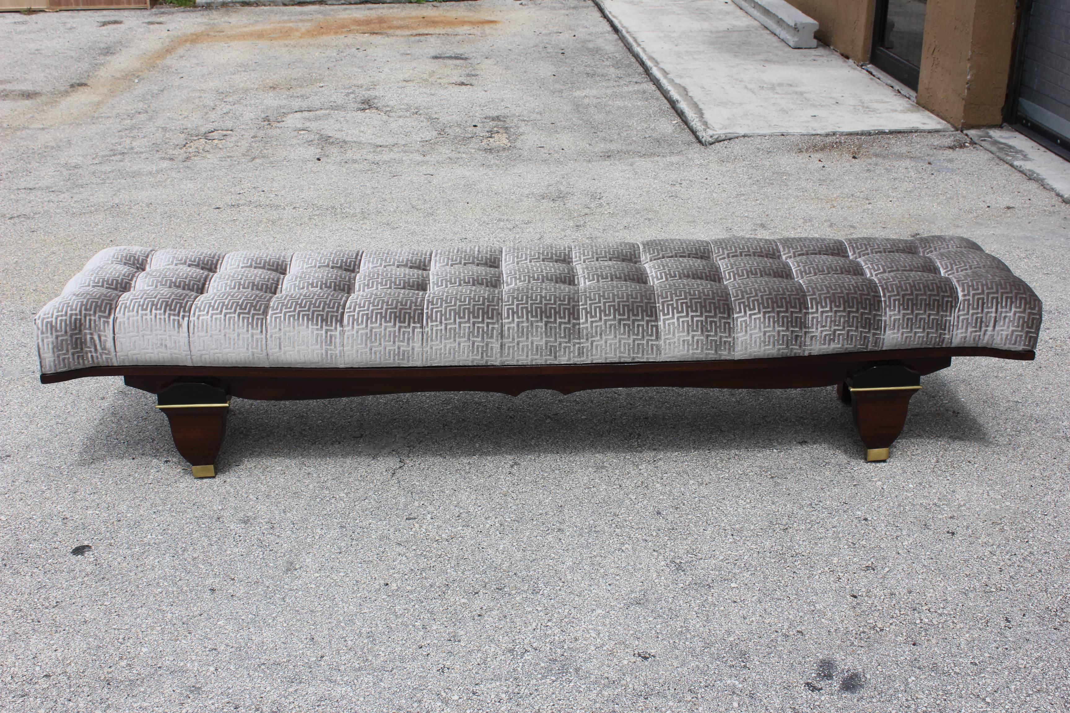 A stunning French Art Deco exotic Macassar ebony sitting bench, circa 1940s. Beautifully detailed, curved end detail. Newly upholstered in a very high end textile. French estate item.