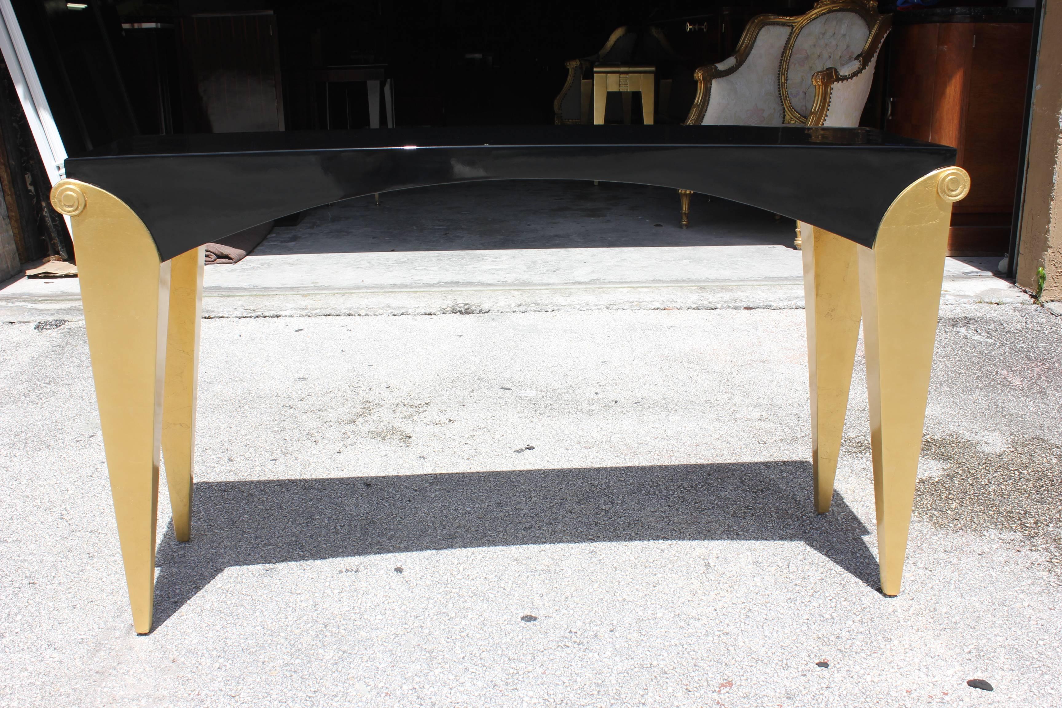 Mid-20th Century Pair of French Art Deco Giltwood/ Black Lacquered Console Tables, circa 1940s
