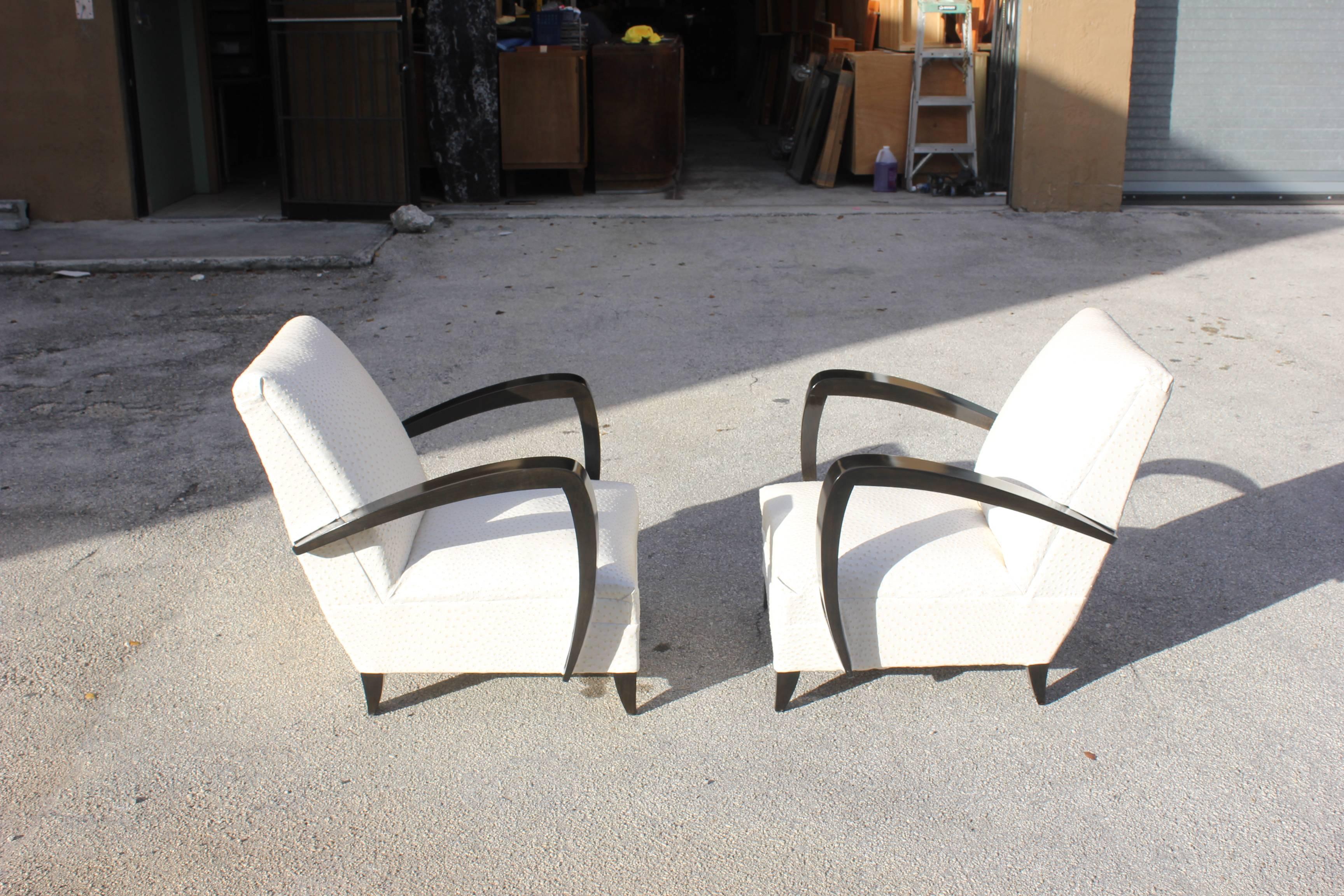 Elegant pair of French Art Deco armchairs or club or lounge chairs, new ostrich style textile Reupholstery and solid mahogany wood, outstanding high gloss finish. Attributed to Rene Prou designed, circa 1940.