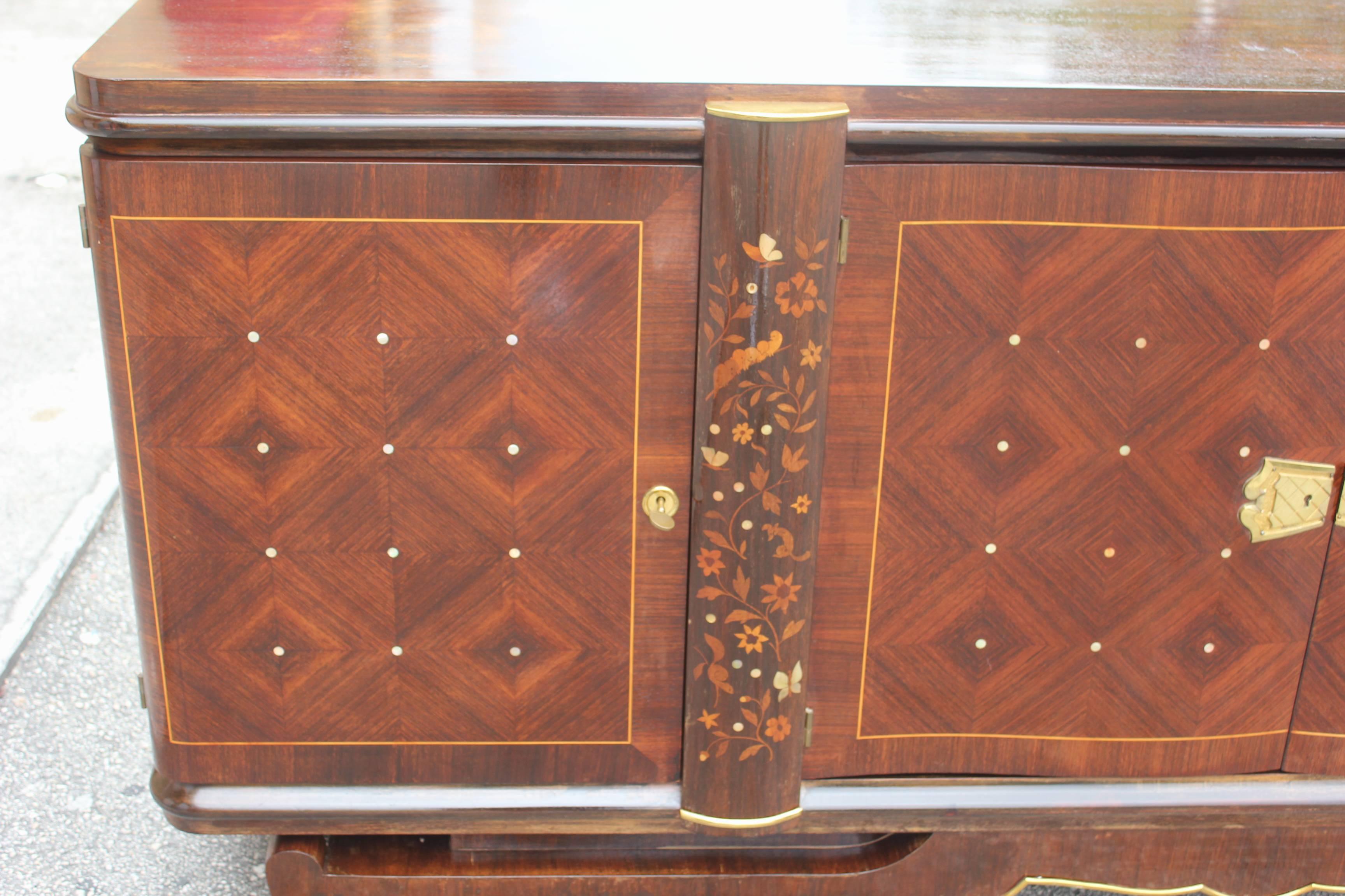 French, Art French, Art Deco Jules Leleu style buffet in Palisander with mother-of-pearl and exotic wood inlay. This piece is in very good condition, circa 1940. Please note these buffets can be taken apart to accommodate elevator needs if