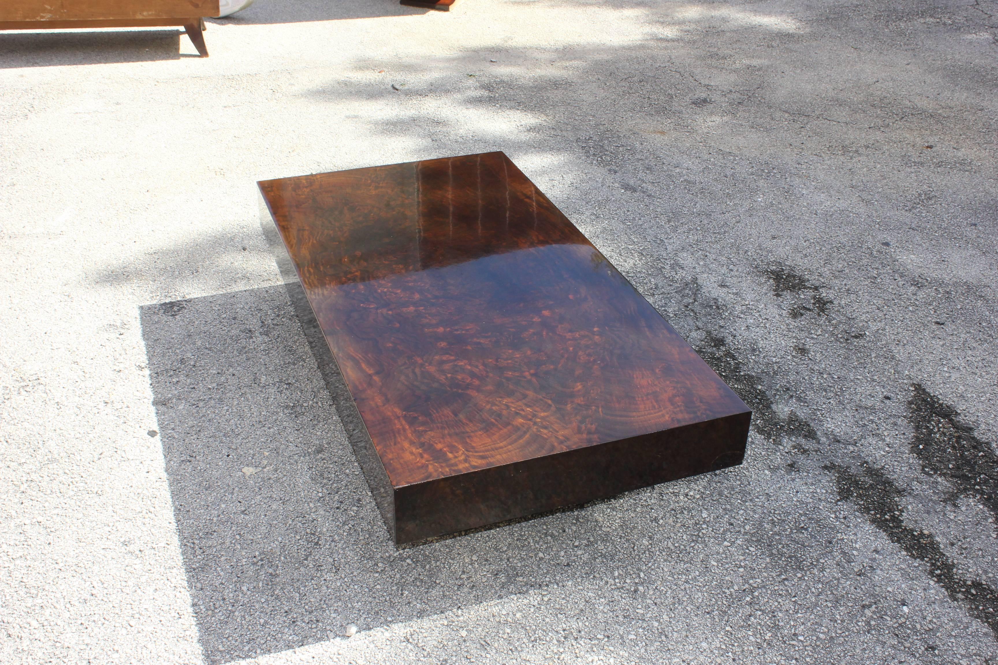 This French Art Deco period coffee table, circa 1940. Burl walnut, makes it ideal next to a sofa or family room. A fine example of Classic, French Art Deco.