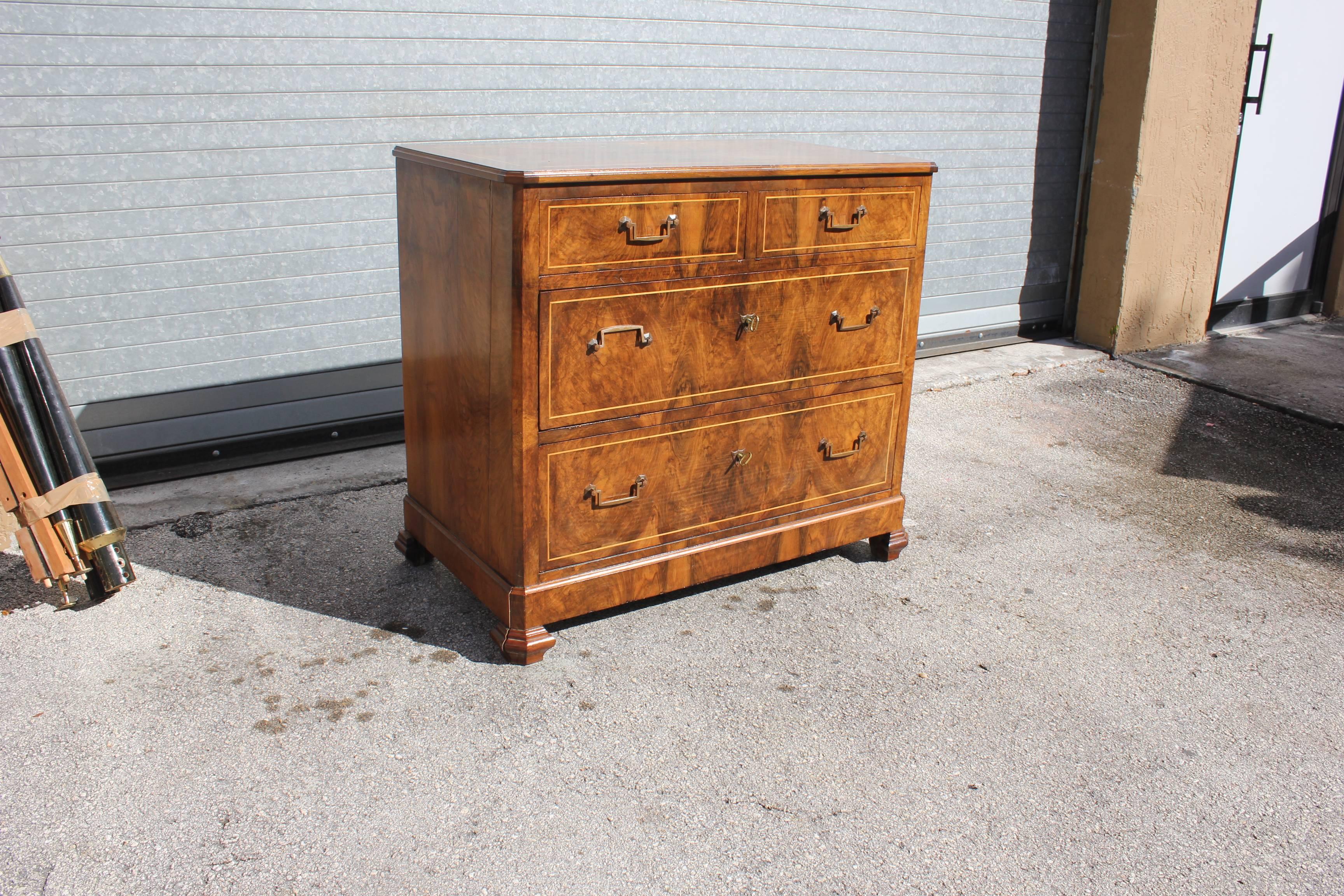 Handsome Louis Philippe commode burl walnut with bookmatched front, having four drawers and raised on mounded bracket feet. The simple elegant lines of this antique French chest make it suitable for many interiors from Bordeaux, France.