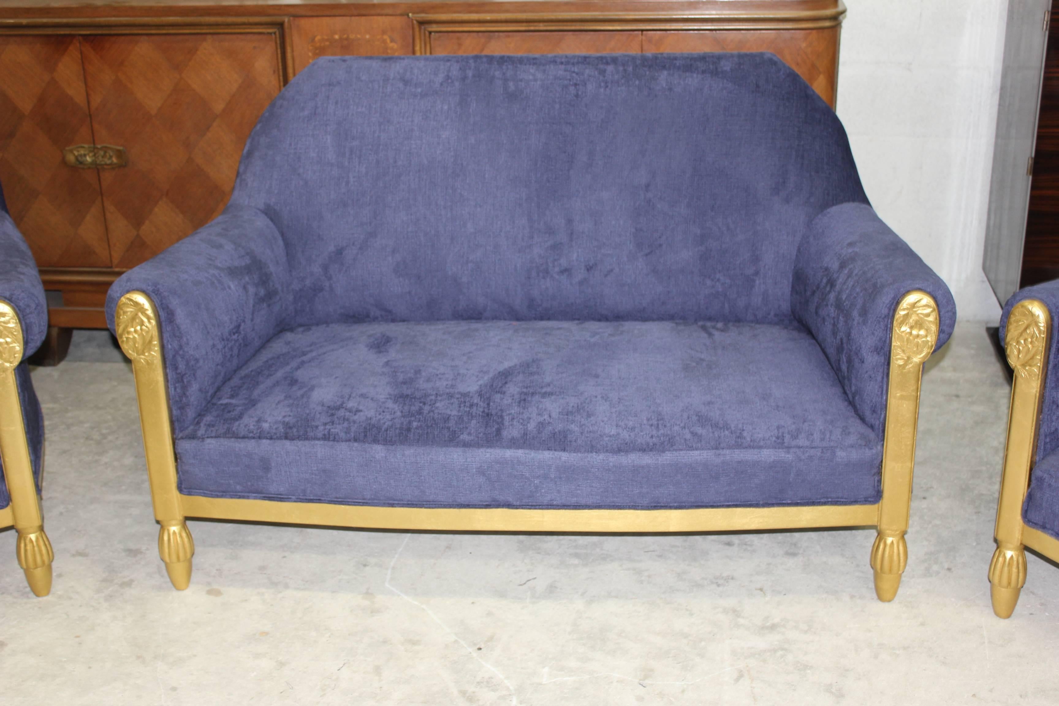 We present an elegant, Art Deco settee by one of the most important designers of the Art Deco period Paul Follot with gilded wood and decorative carved panels, in the Classic early 1920s , all of which have been newly re-upholstered in royal blue