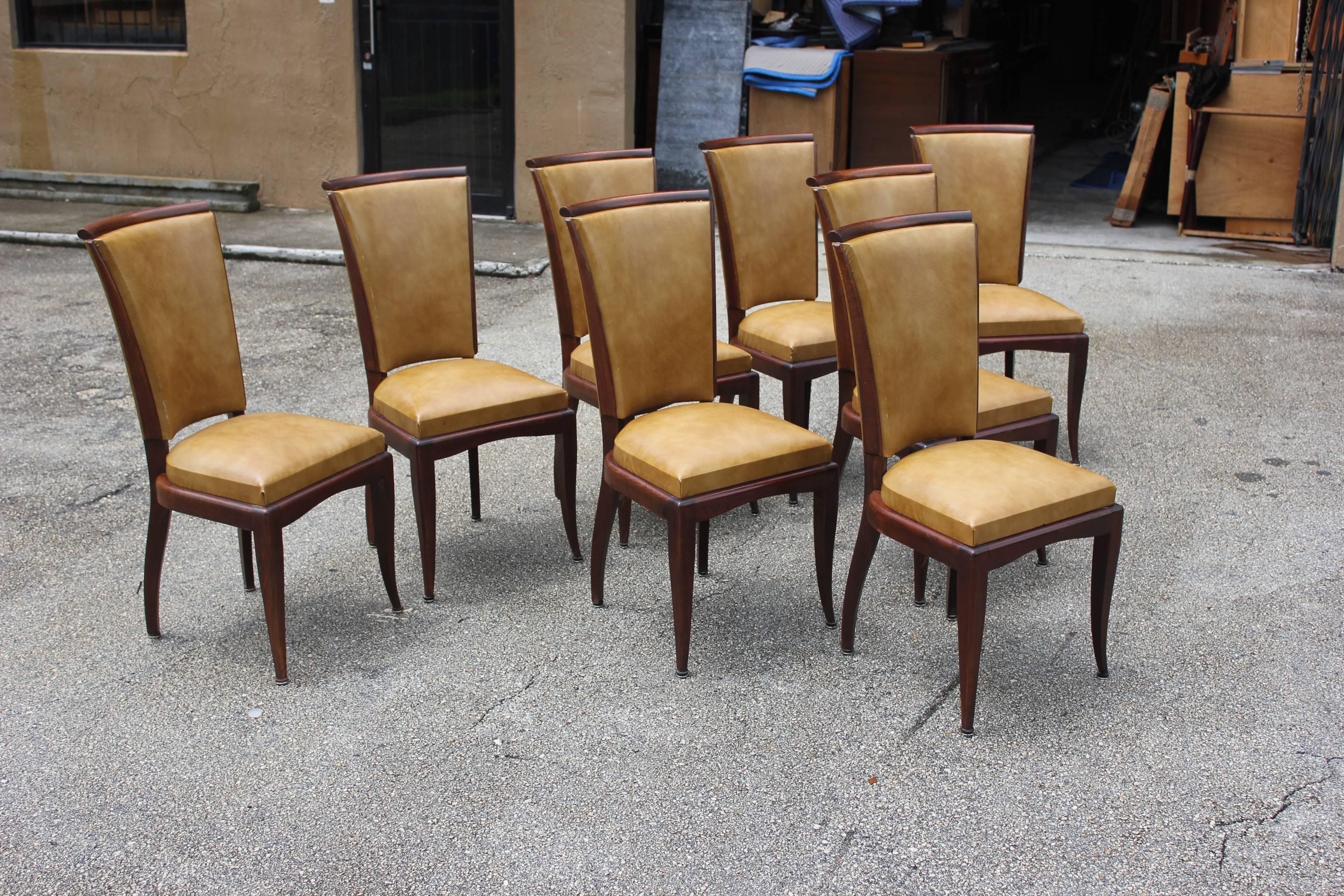 Suite of eight French Art Deco dining chairs style of Jules Leleu, solid mahogany, beautiful chairs. Reupholster is vinyl recommended, circa 1940 from France, Paris. Beautiful chairs.