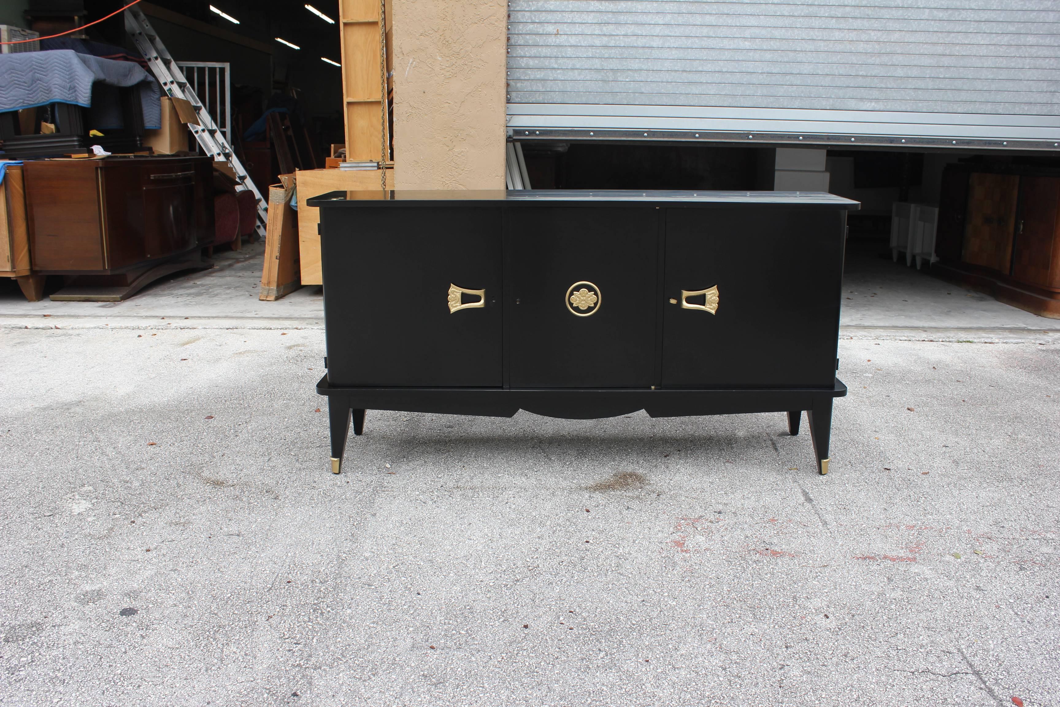 Description a French art deco, sideboard, buffet or bar ebonized finish. Beautifully, circa 1940s. Newly lacquered inside and out, very perfect condition. Dimensions: 71.0