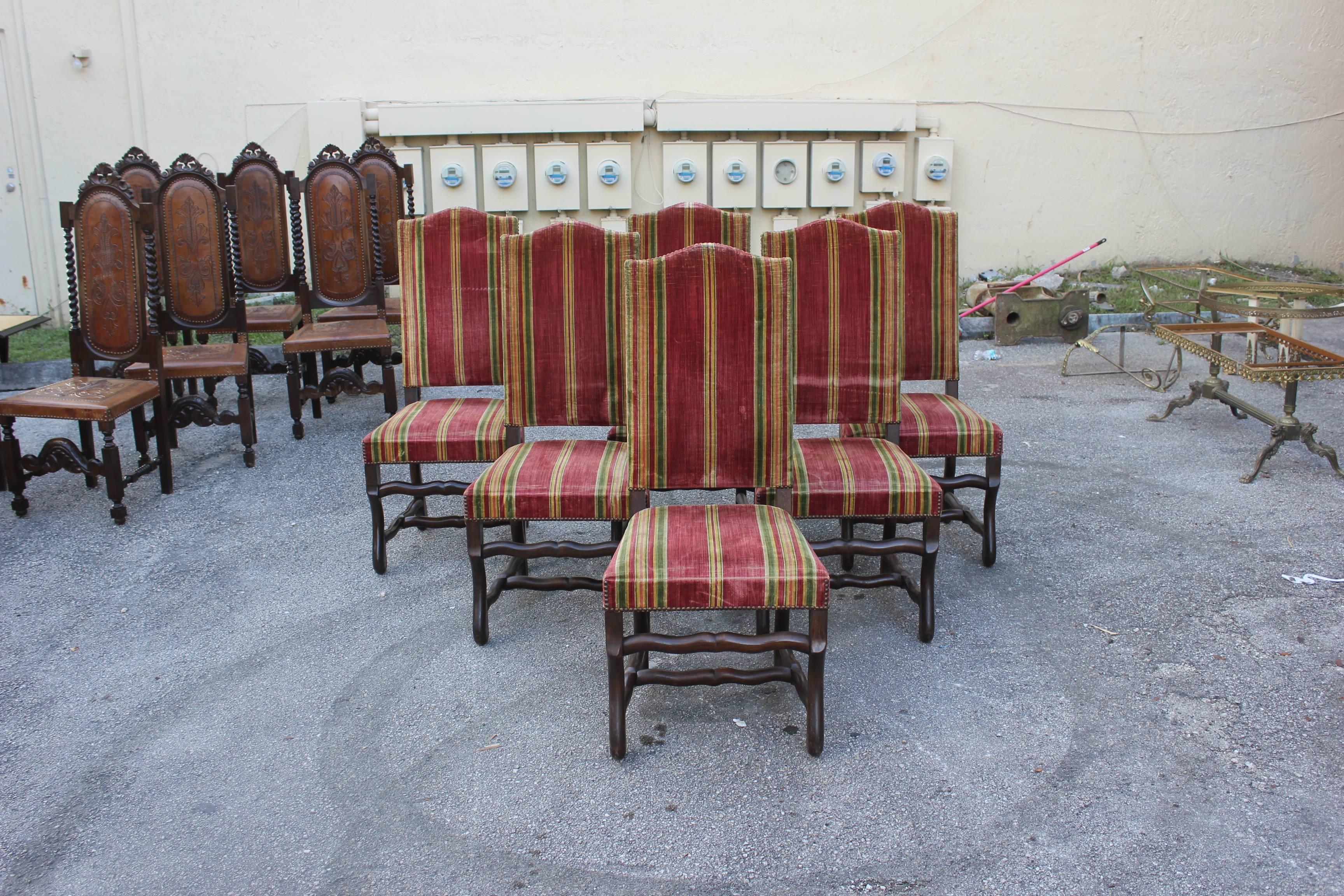 Monumental set of six Louis XIII style Os de Mouton dining chairs with chapeau de gendarme backs, circa 1880s. Vintage fabric upholstery with nailheads, solid walnut chair frames are in excellent condition. From South France Bordeaux. We traveled to