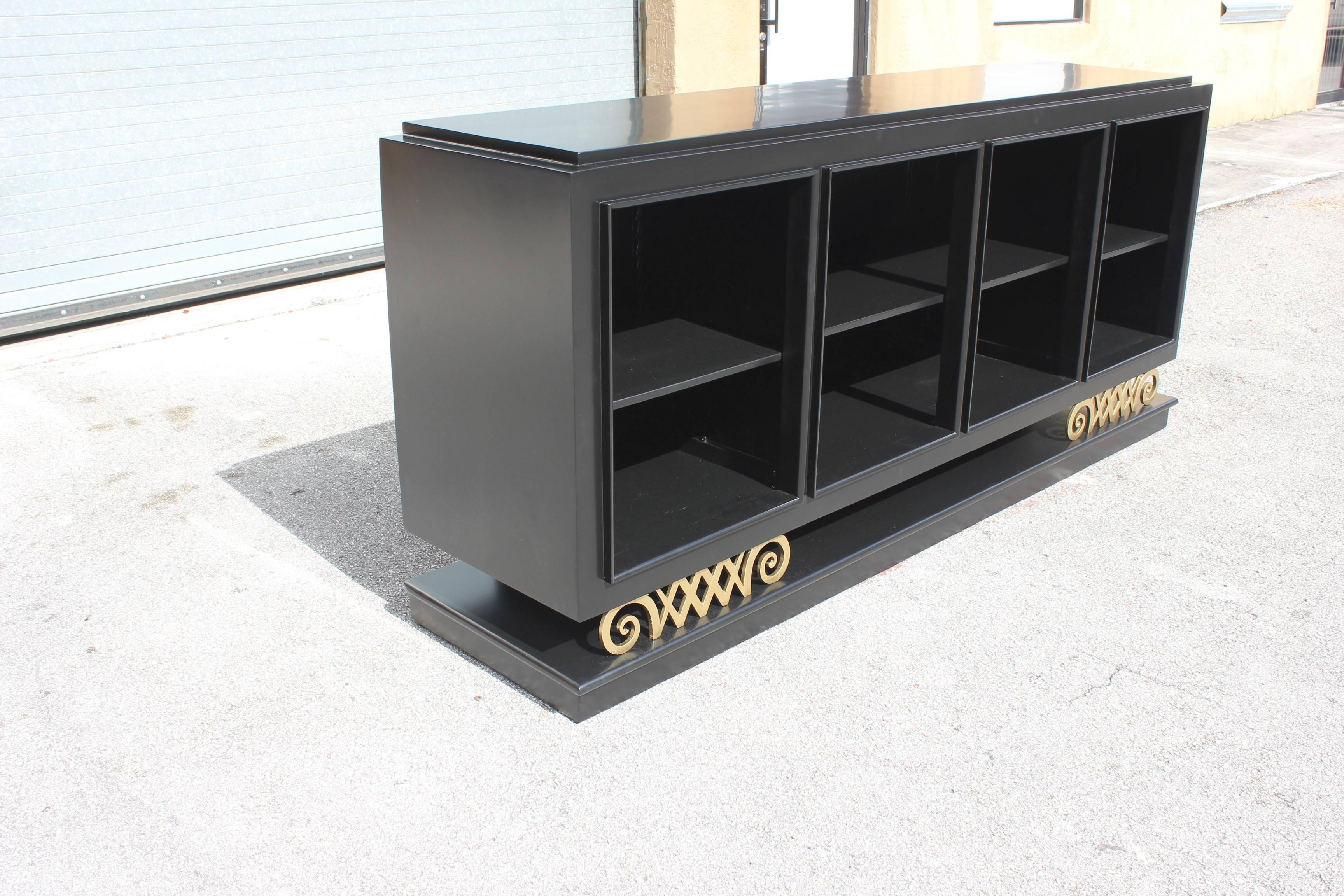 A Classic French Art Deco, ''Ebonized''Sideboard,buffet or credenza or bar With Beautiful '' Harlequin Leg '', Open shelves And All Adjustable shelves ,circa 1940s. Newly lacquered inside and outside , very good condition. SIZE 87.50 W . 39.25 H .