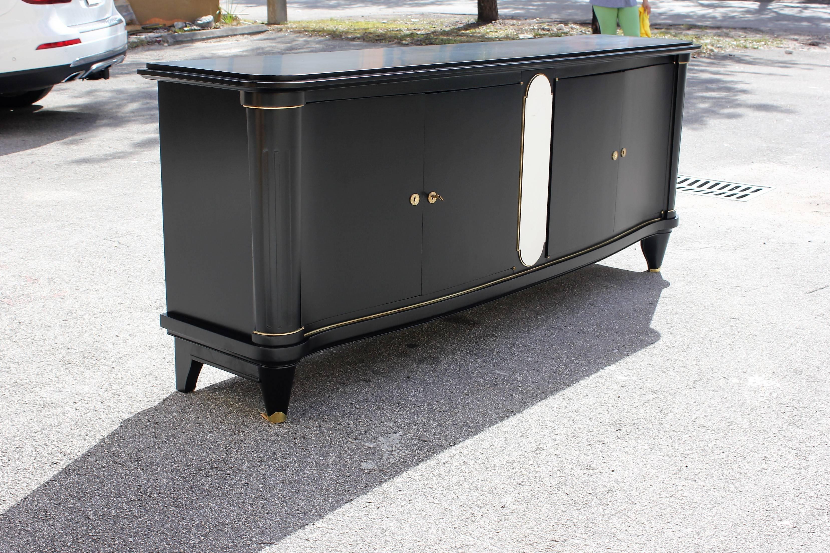 DESCRIPTION Monumental French Art Deco Ebonized Sideboard / Credenza Parchment Center 1940s. parchment center with bronze detail hardware ,beautiful hardware bronze detail ,refinish inside and outside in perfect condition, all shelves adjustable two