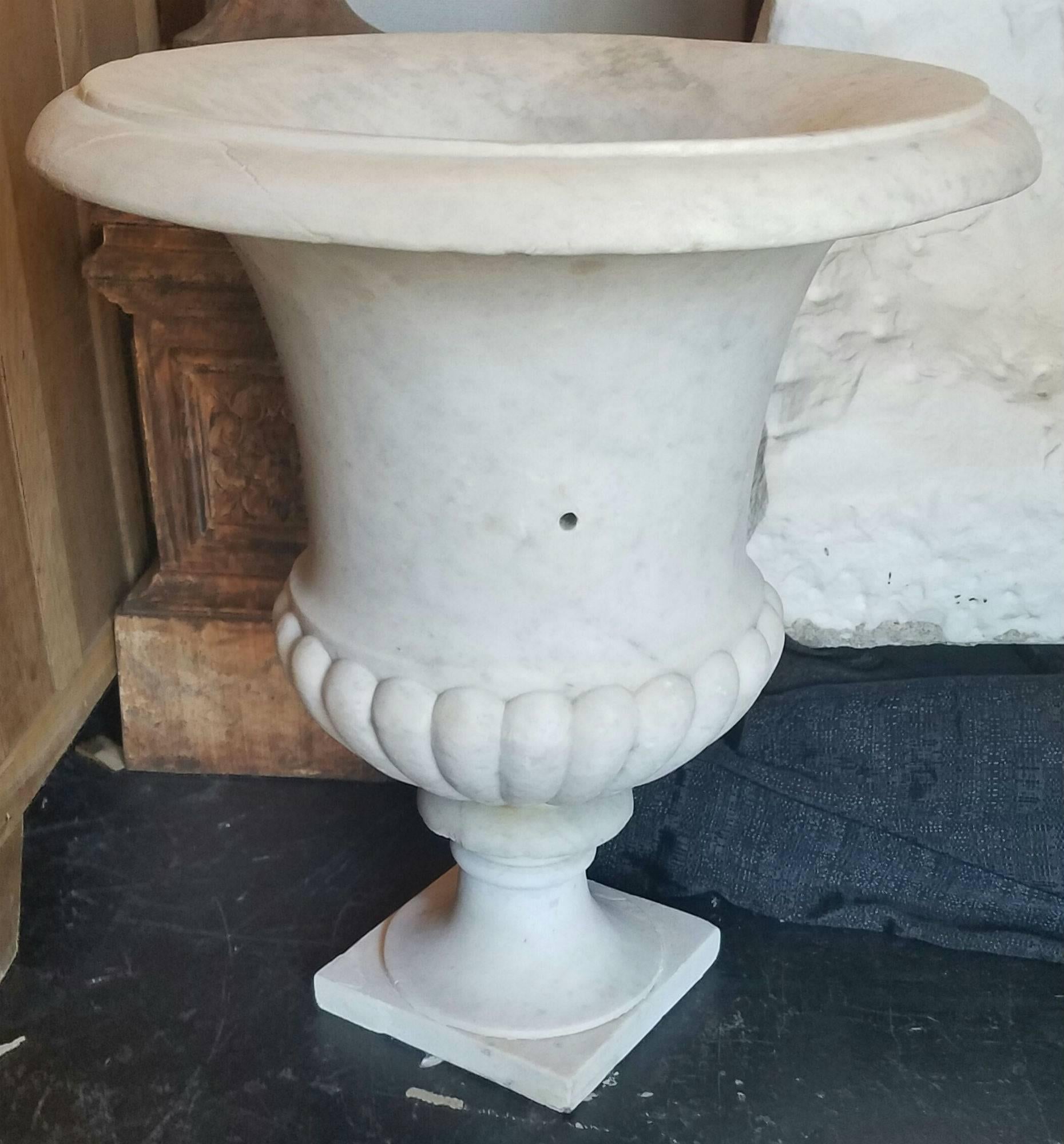 Large pair of carved white marble campana-form garden urns.