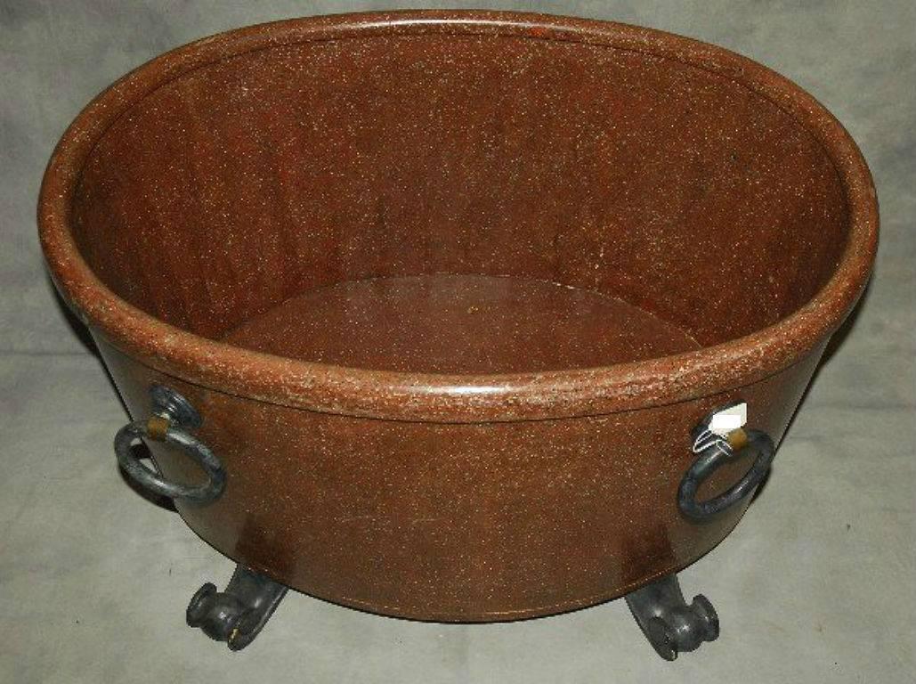 Large antique faux porphyry marble and carved wood oval wine cooler. H: 21