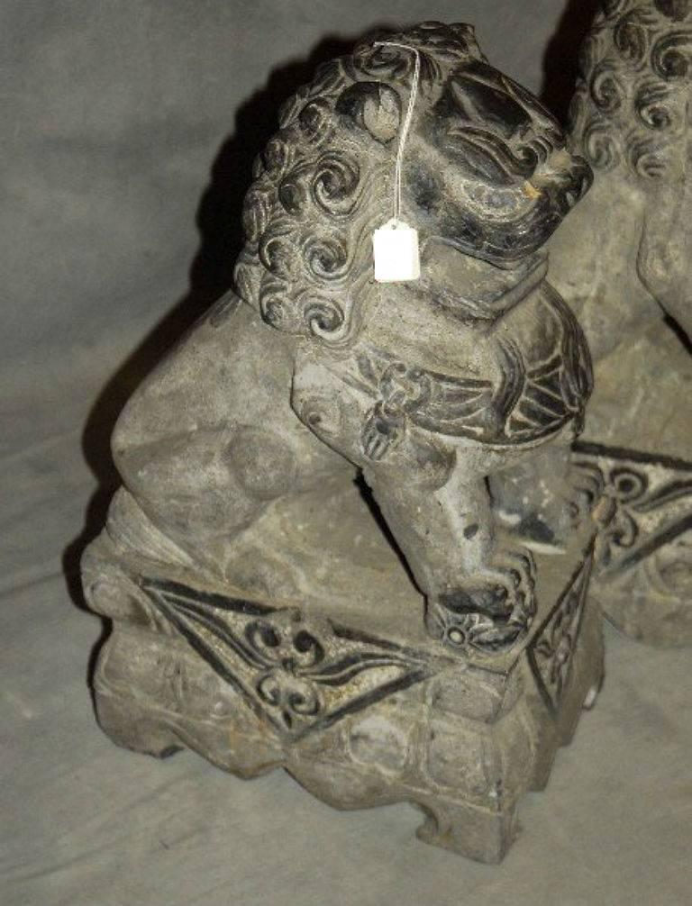 Pair Chinese carved grey marble Foo dogs. H: 22