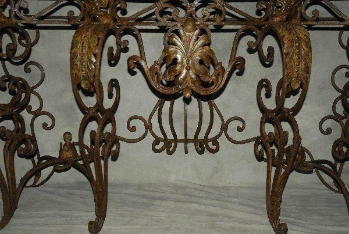 Wrought iron and Verde marble-top console table. 