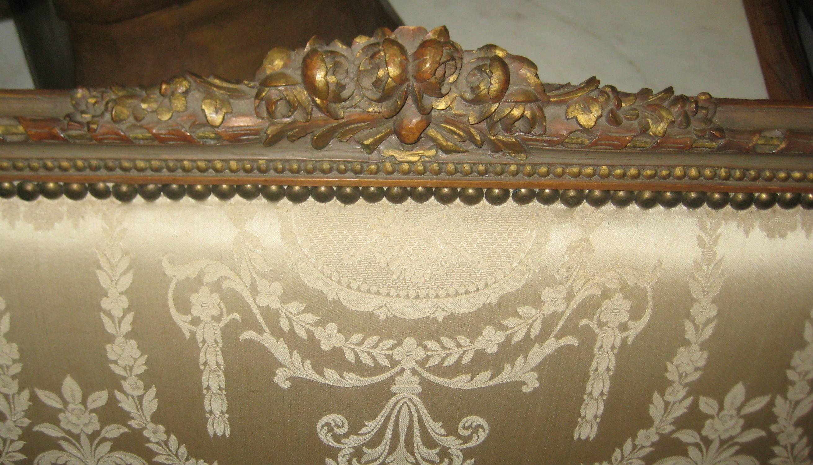 Louis XVI style carved fruitwood and partial-gilt damask upholstered sofa (canapé) with down seat.

After 43 years of business we are retiring. Everything must be sold. Many of the pieces listed here on 1stdibs represent markdowns below our cost.