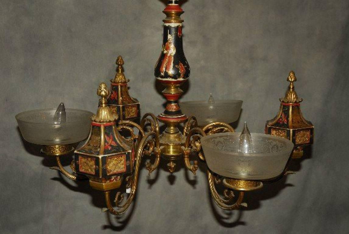 Antique bronze and porcelain Chinoiserie decorated six-light chandelier, with Chinoiserie decorated porcelain standard issuing three arms with lighted pagoda form lanterns and three arms with etched glass shades. H: 26
