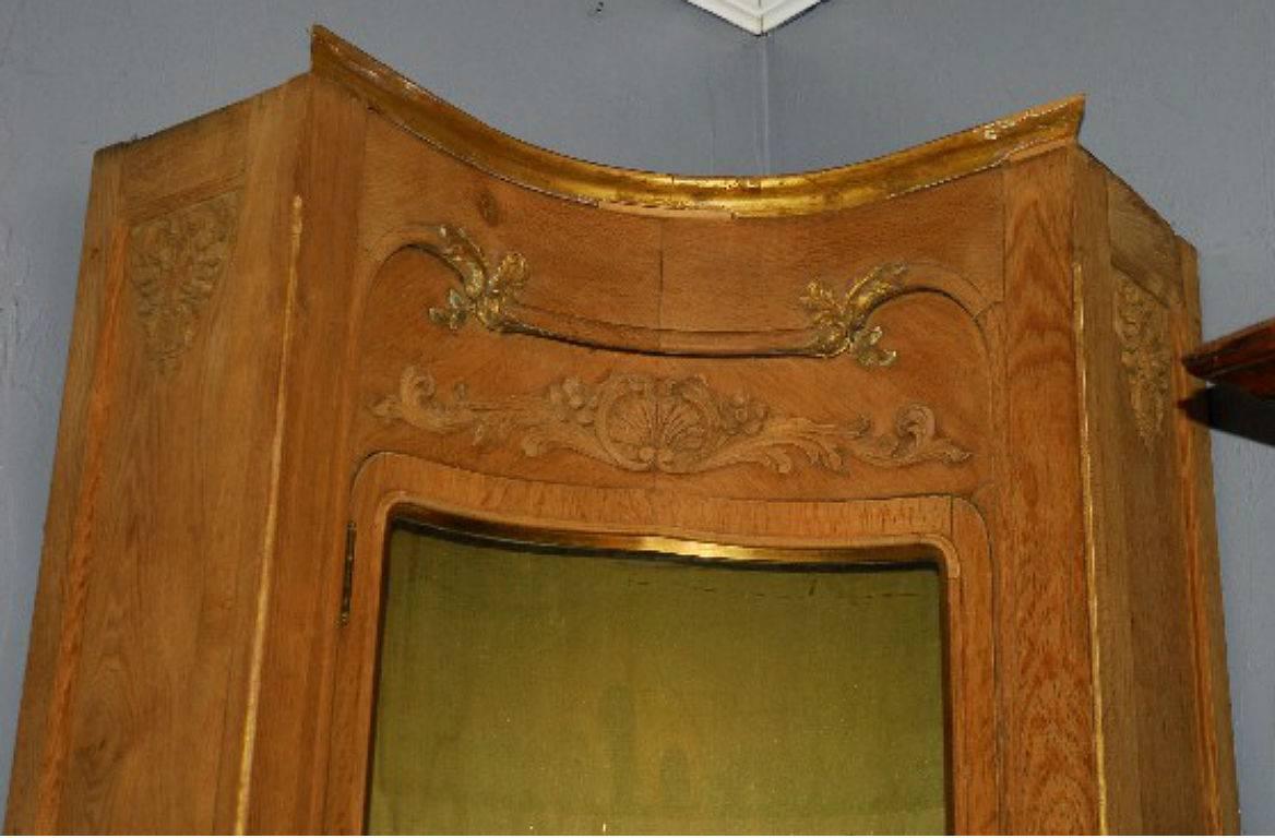 Large French carved oak and Vernis Martin painted corner curio cabinet with concave glass door enclosing glass shelves above a cabinet door.

After 43 years of business we are retiring. Everything must be sold. Many of the pieces listed here on