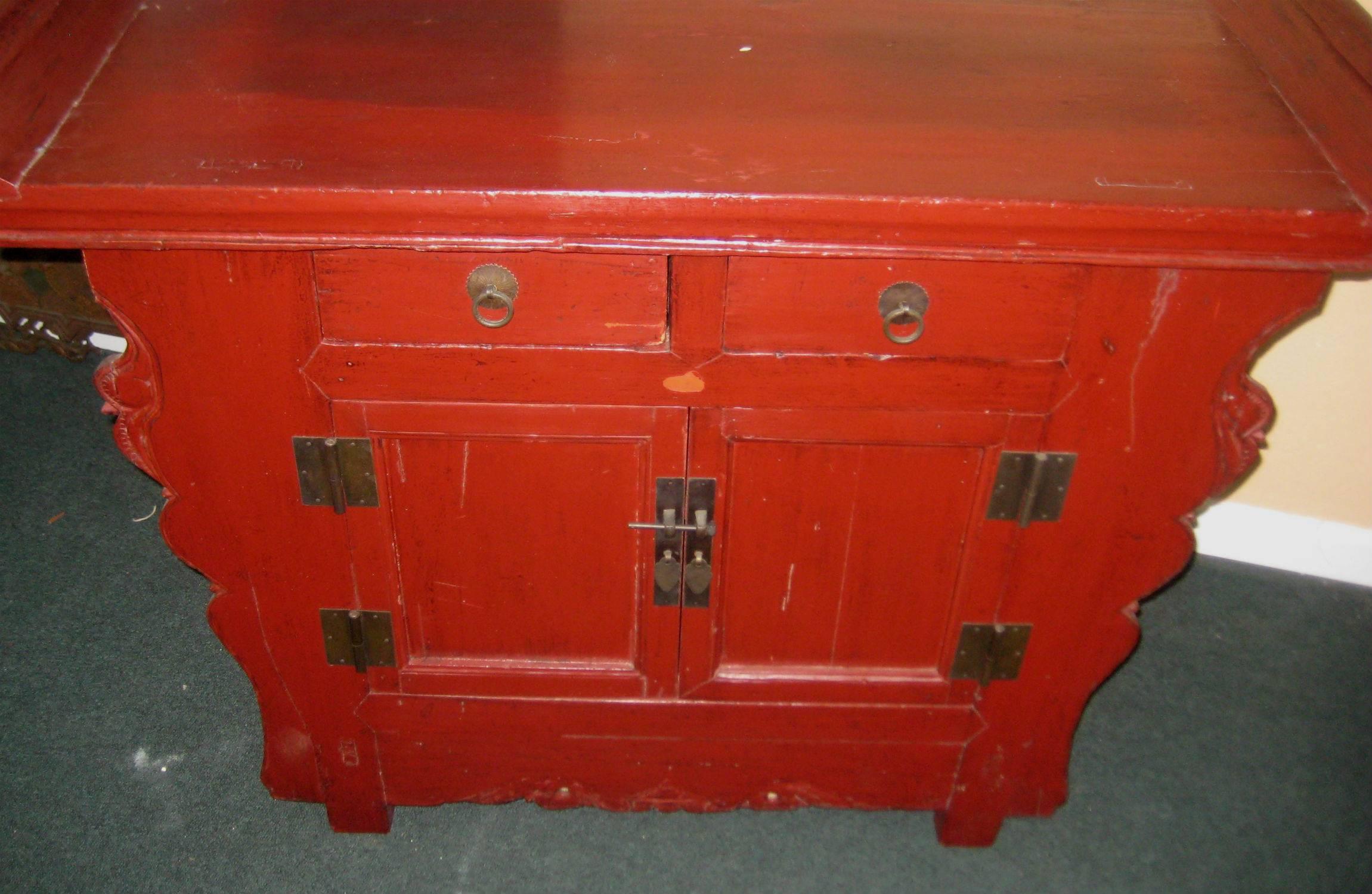 Chinese carved elm and red lacquer coffer. Measures: H: 35