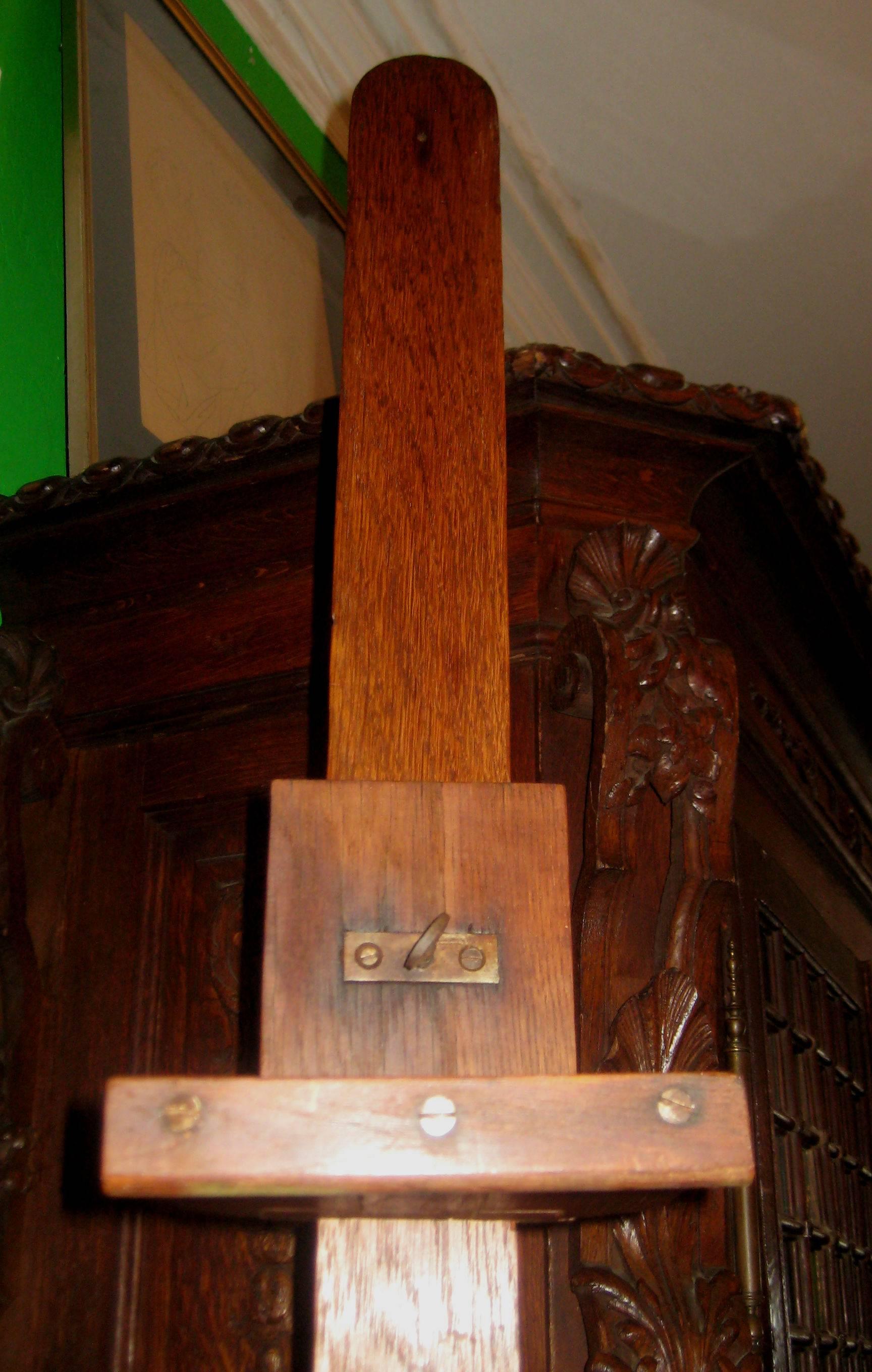 Arts & Crafts (Mission) oak adjustable artist studio easel on four brass casters.