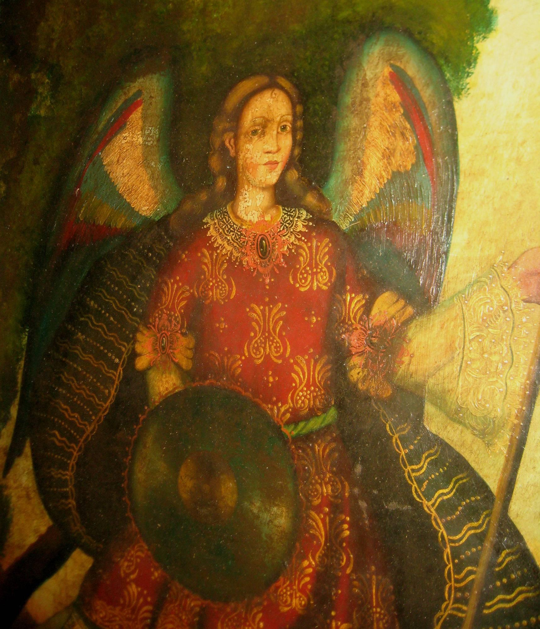 Cusco School oil on canvas of the Archangel Michael in a beautiful carved wood frame. Overall: 31