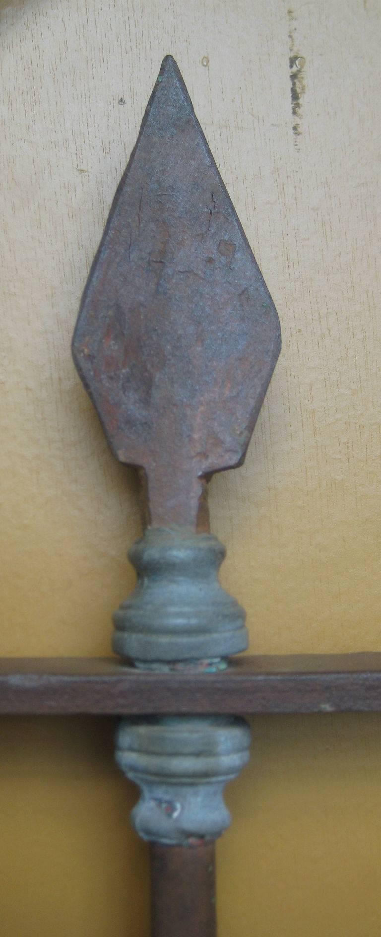 Pair of wrought iron arched window guards with seven spade top and decorative lead posts. Each measures: H: 66