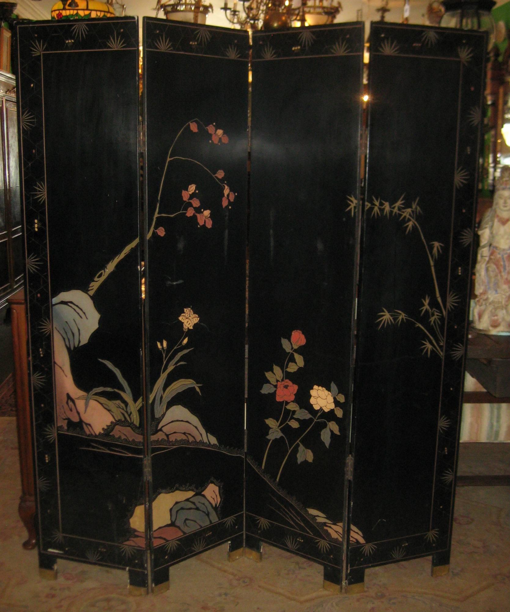 Chinese four-panel black lacquered coromandel folding screen, colorfully incised depicting courtly beauties in a palace engaged in leisurely pursuits, with an arrangement of flowers on the reverse. Height: 72