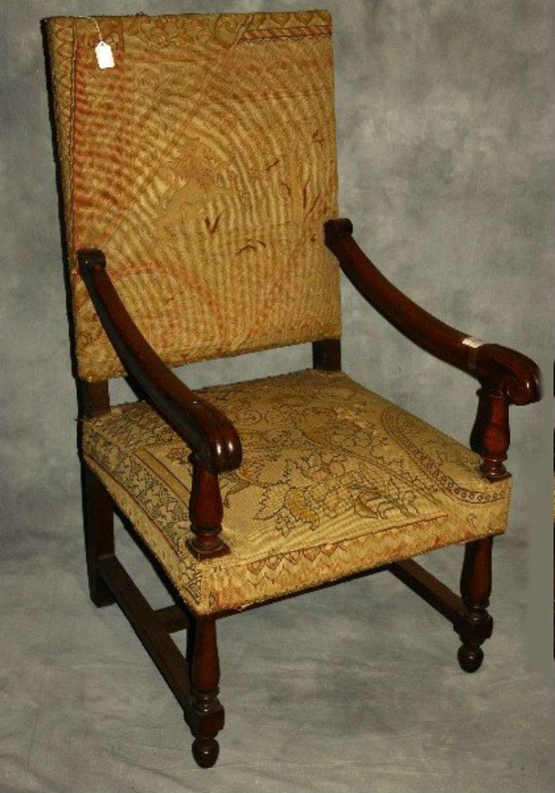 Pair of Louis XIV style carved oak armchairs with needlepoint upholstery.