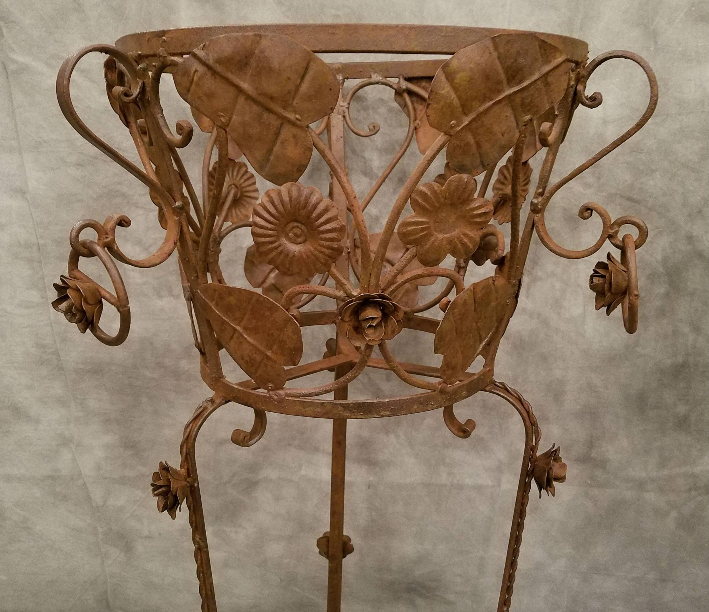 Pair of decorative leaf and flower iron plant stands.