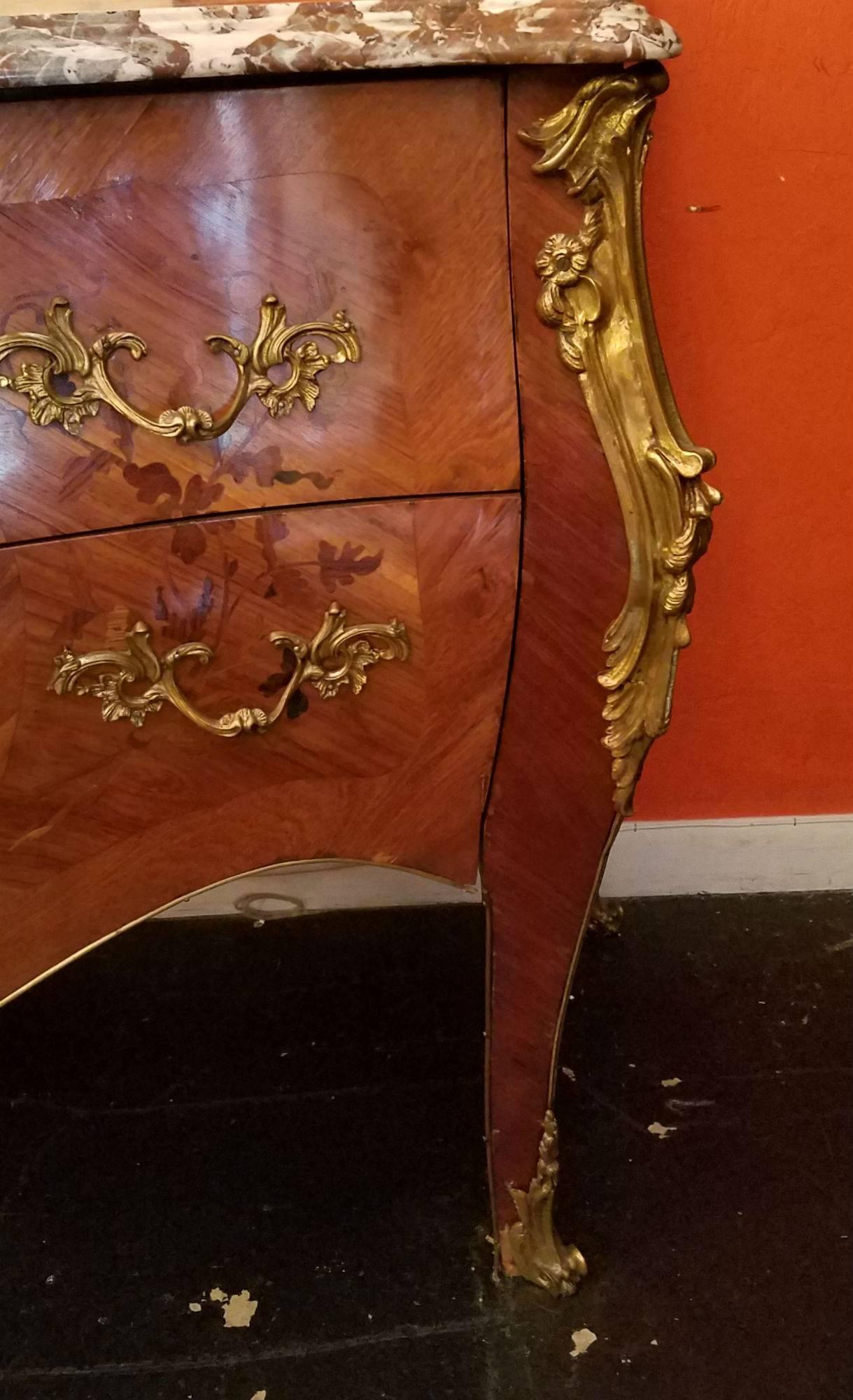 Louis XV style marquetry inlaid bronze-mounted marble-top two-drawer bombe commode.