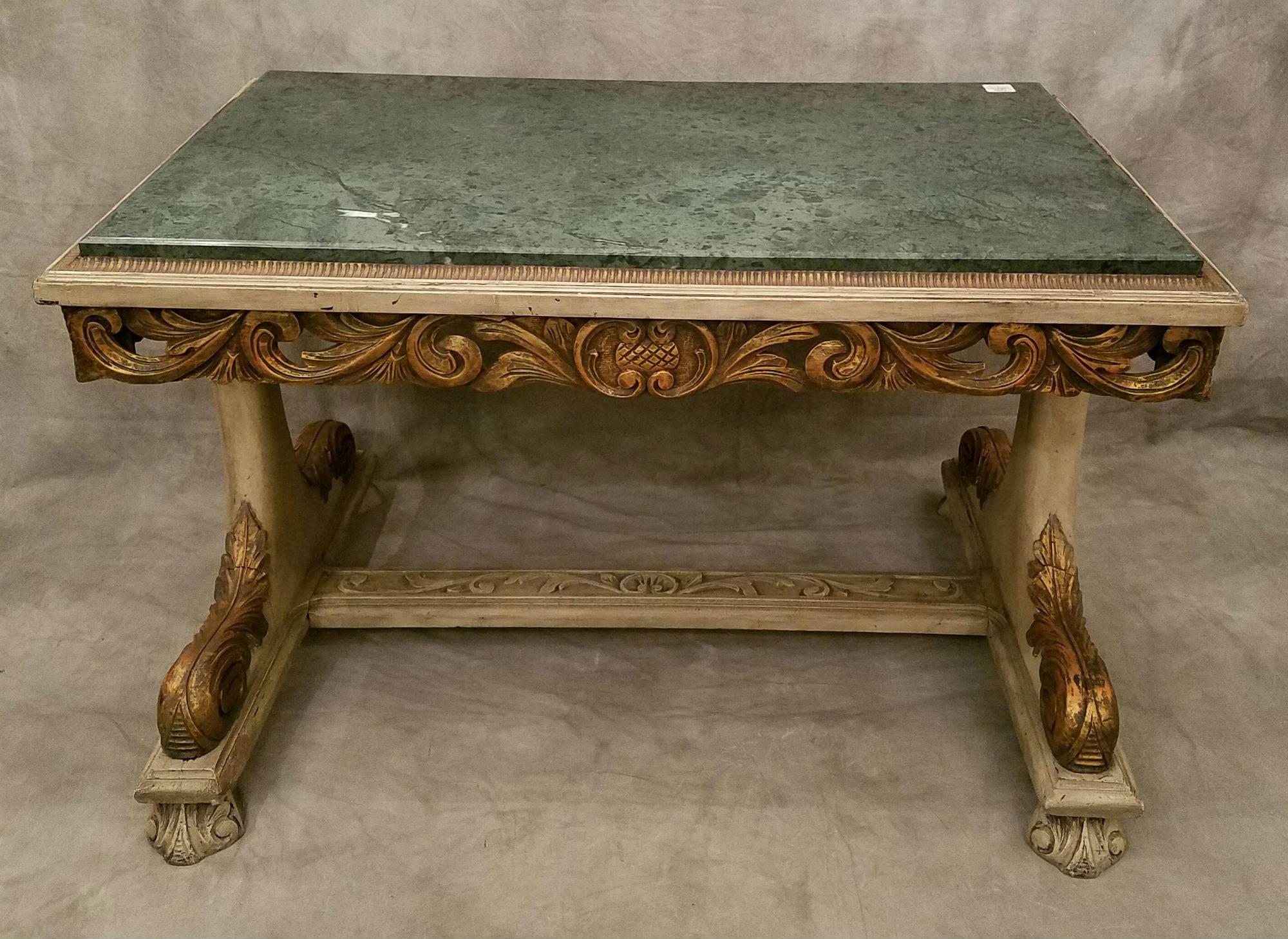 Italian carved painted and partial-gilt Verde marble-top center table.