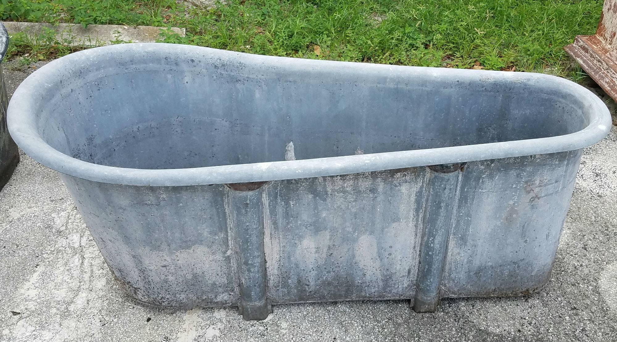 French Empire zinc bathtub. The outside foot of the bathtub has the original seal. 

These make great outdoor garden jardinières.