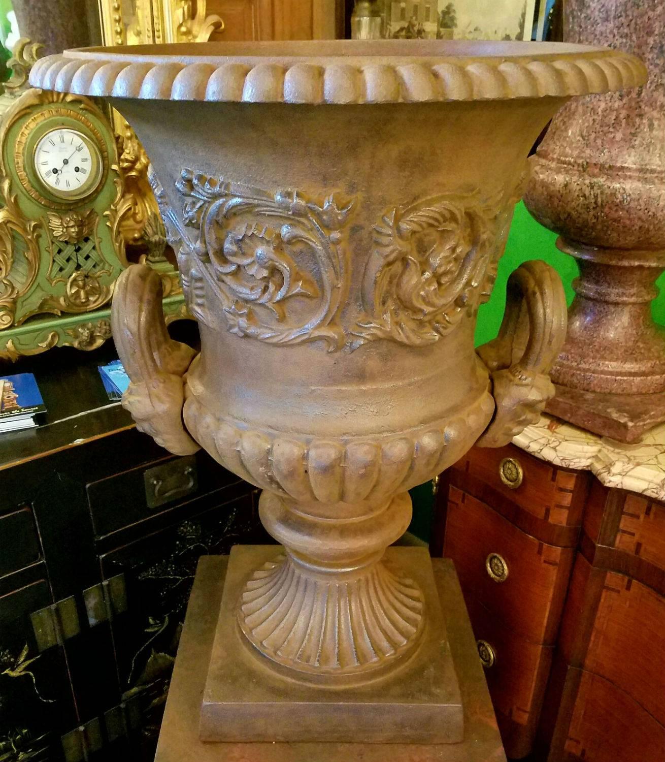 Antique cast iron garden urn and pedestal.

Measures: Overall height 54.75