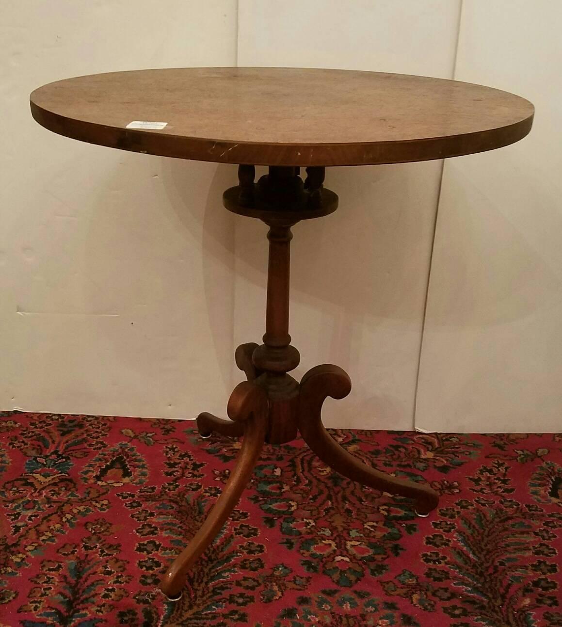 Pair of revolving top tables; walnut tops on a mahogany standard and legs.