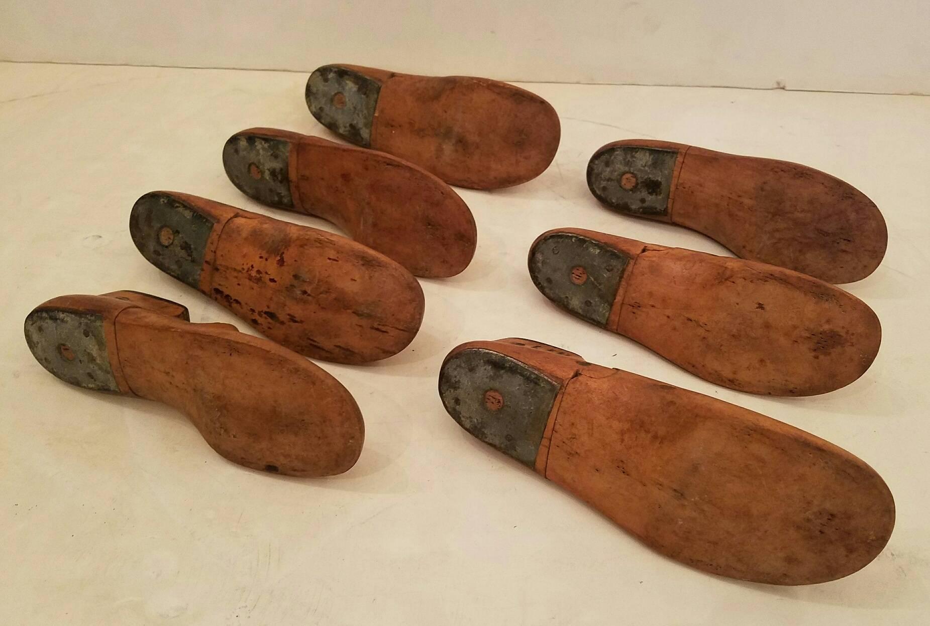 Seven vintage wood shoe molds (shoe lasts). 

Largest measures: Height 3