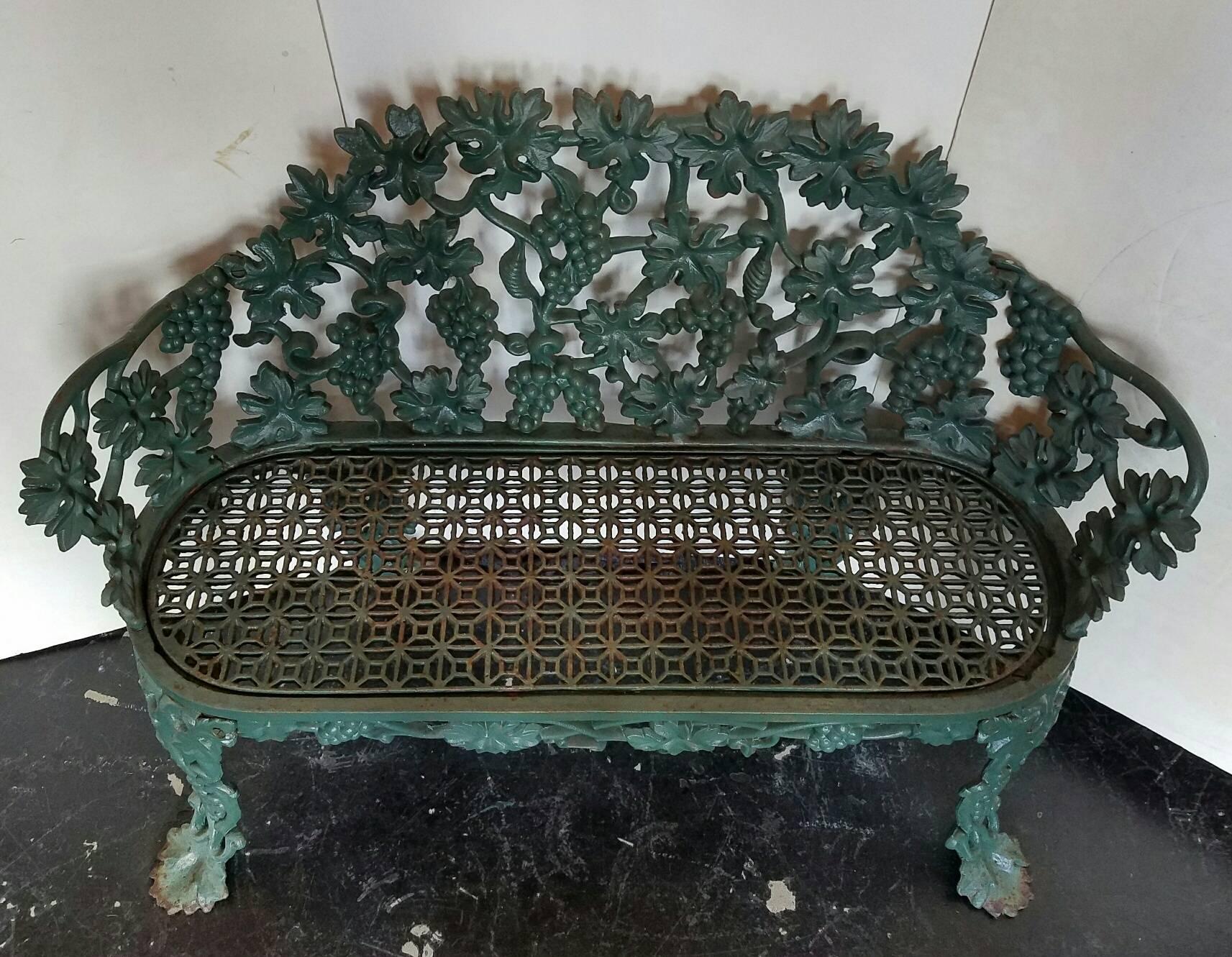 Antique cast iron green painted bench.