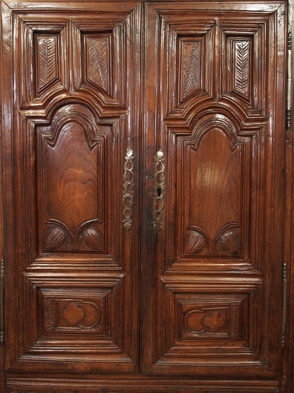 17th century Louis XVI carved chestnut and walnut armoire, circa 1698.