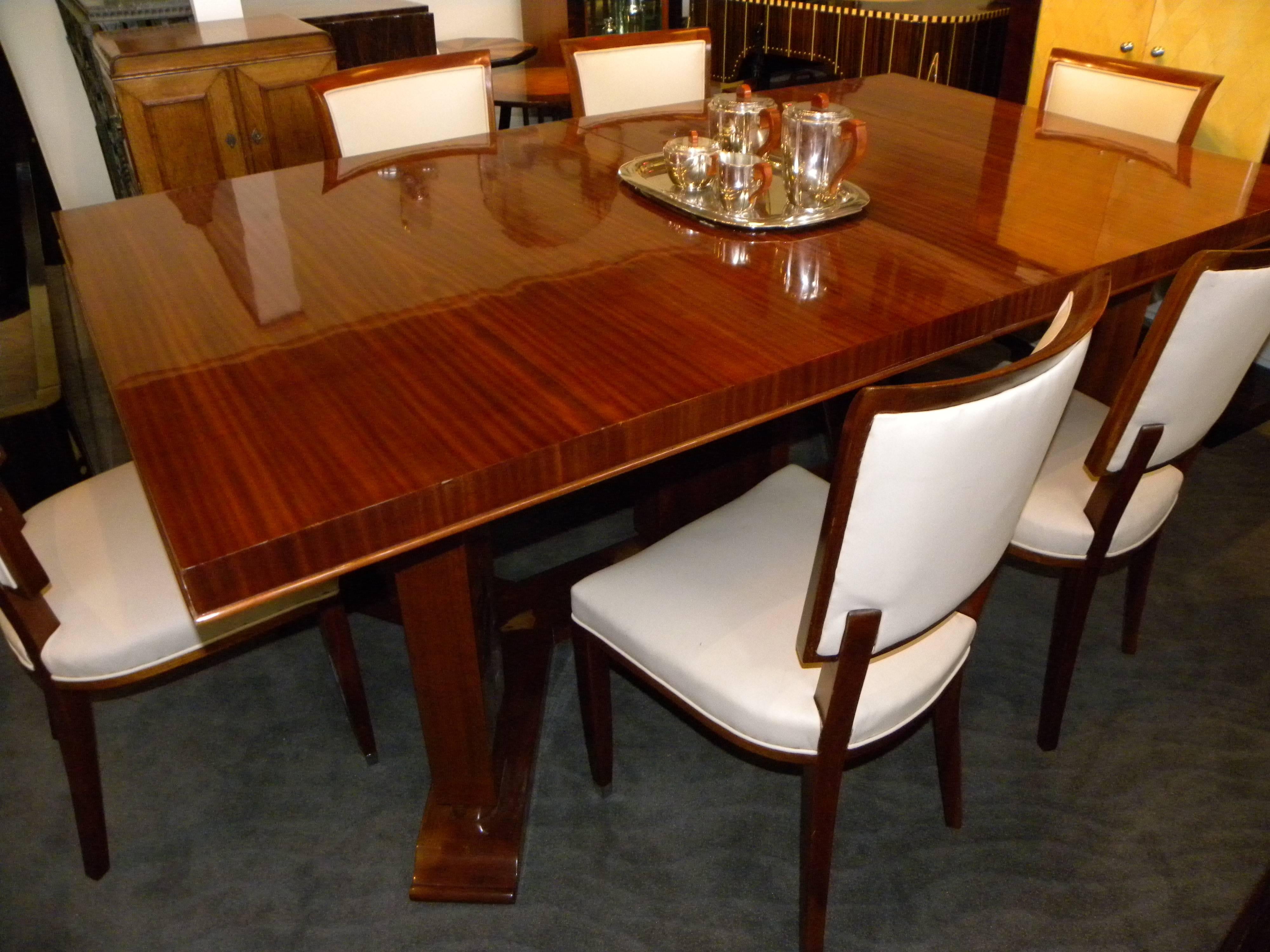 Jules Leleu created this spectacular Art Deco dining room table and chairs. Leleu was one of the most important and prolific names in furnishings of this period. What gives this particular table and chairs even more significance is the fact that