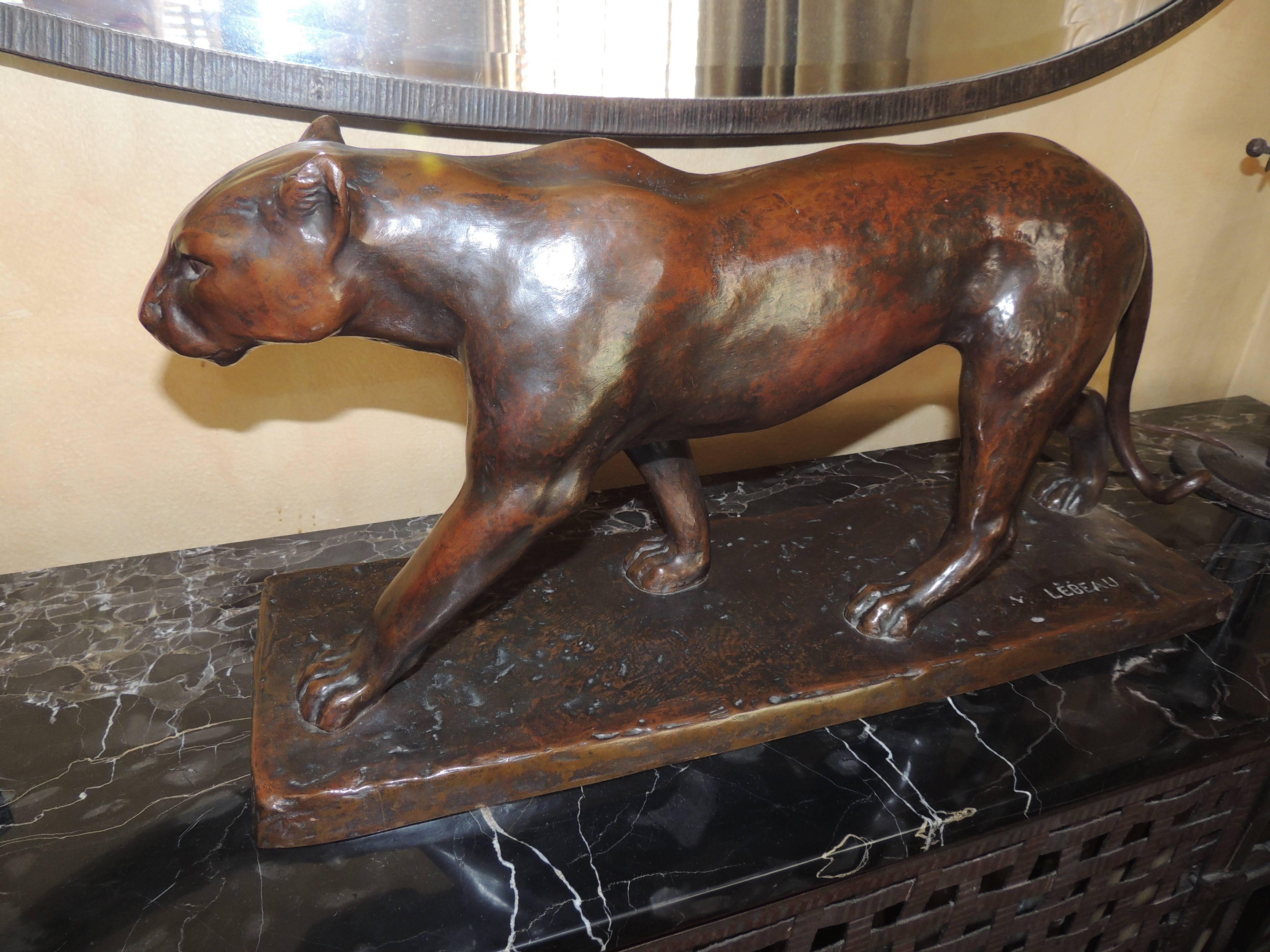 This sleek Art Deco bronze panther is the embodiment of all those ideals of the era: Speed, strength, richness, perfection! Heavy to lift, but smooth to the touch with a lush patina, a great signature and an expressive face!
 
At first glance, it