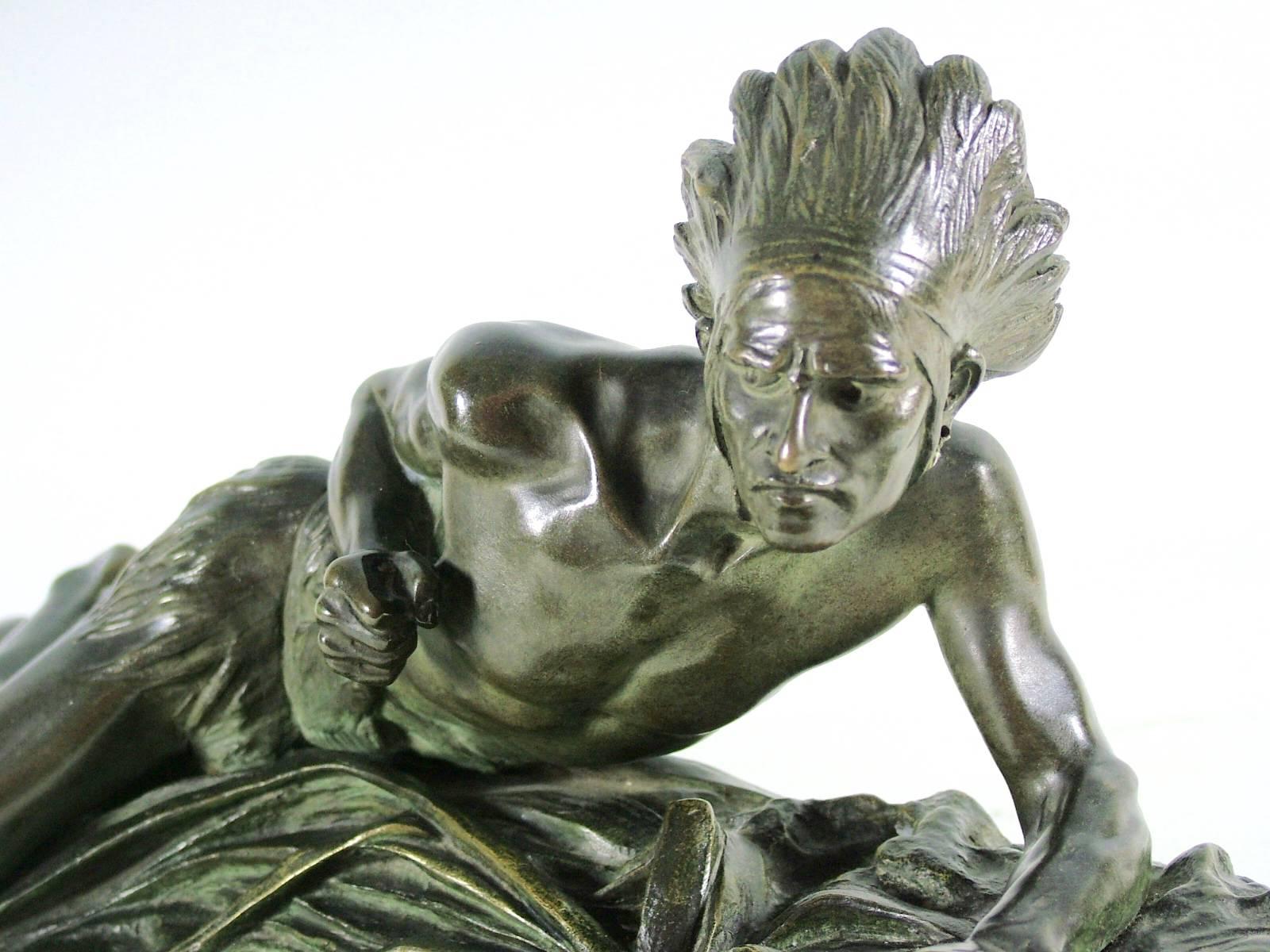 Stunning Indian bronze signed E. Drouot. Cast with plenty of detail depicting an Indian man who is on the lookout while holding a bow in hunting position. Drouot did multiple sculptures rendering the American Indian theme.

Edouard Drouot was born