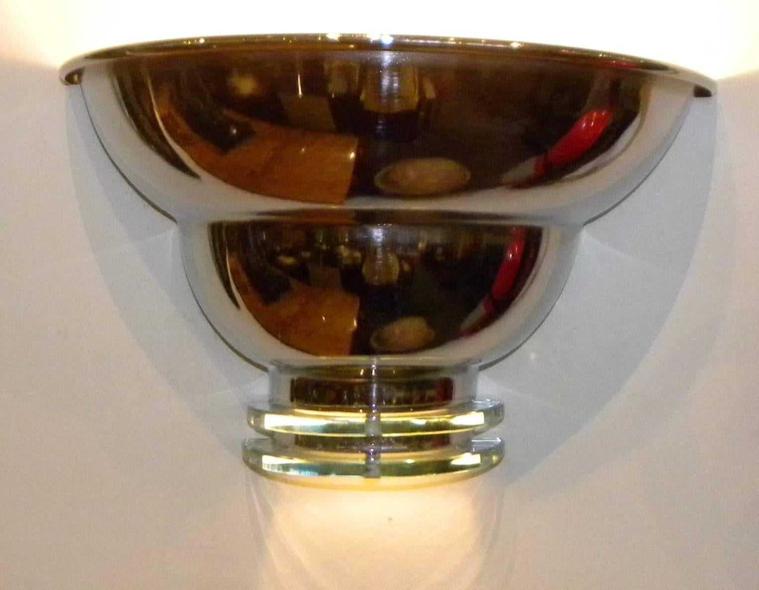 Vintage Art Deco Streamline modern sconces. Wonderful design and a real find, right now we have three pairs available. Newly re-chromed metal with fresh electronics. The glass disks on the bottom are clear and light up as well. Here is a chance for