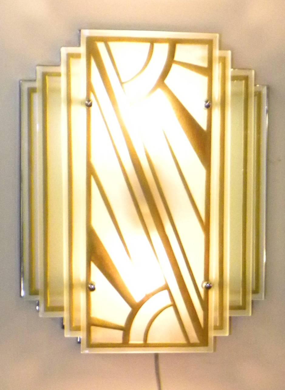 Custom-made Art Deco modernist etched lights. Could be a pair of sconces or used as a flush mount ceiling light. Very high quality thick glass, stepped, each with double bulb utilizing a stylized sunburst pattern. Looks like they just came out of an