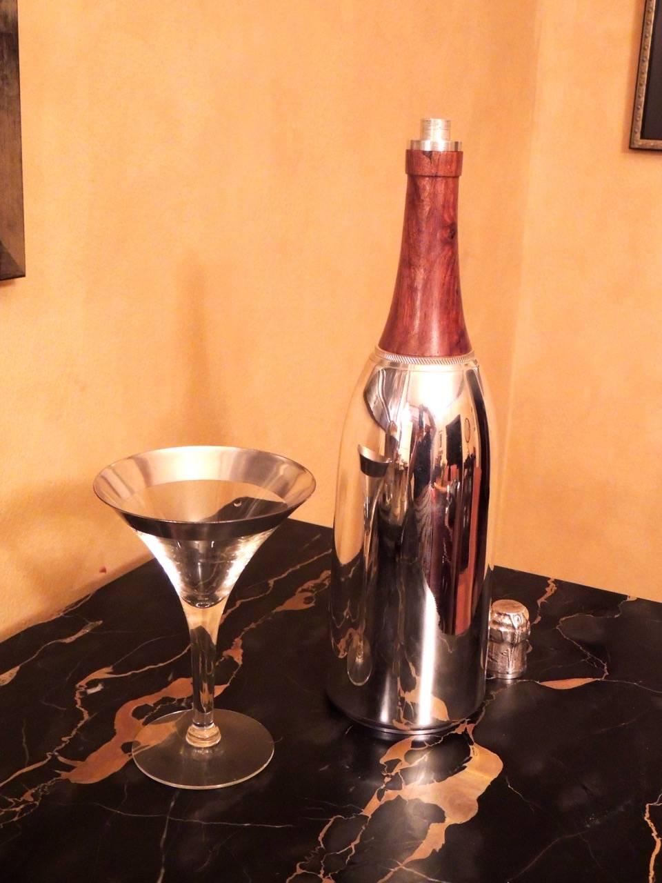 A uniquely designed silver plated champagne shaped cocktail Shaker in perfect condition is a great addition to a Shaker collection with interesting and amusing figural motifs. It would also make a wonderful gift with a sense of celebration.

The