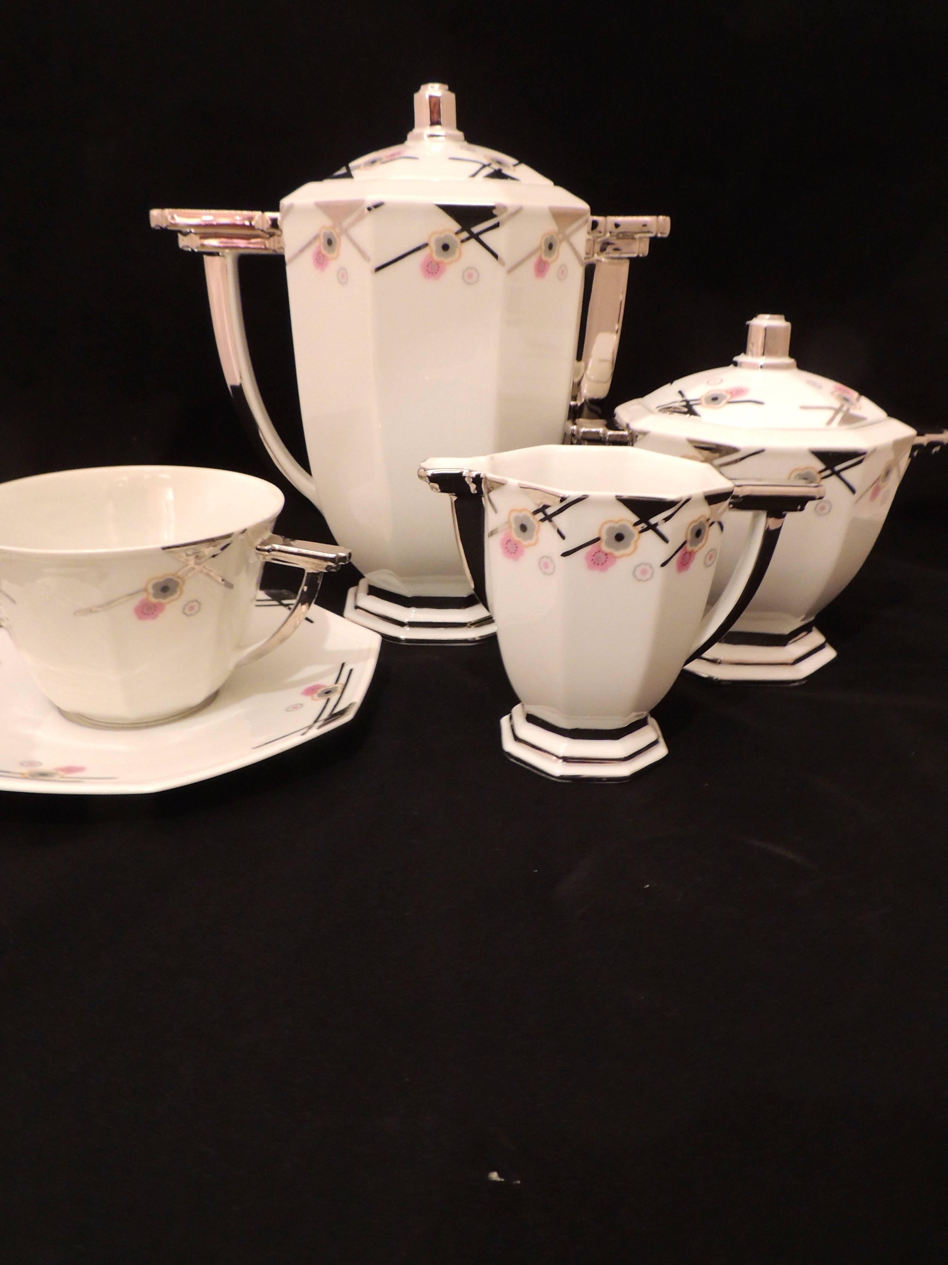 Complete and completely fabulous Art Deco coffee, tea or chocolate set made in France by TLB Limoges: creator of finest china in romantic and modernist designs.

The set consists of:

Large pot

Creamer and sugar

Six oversized cups and